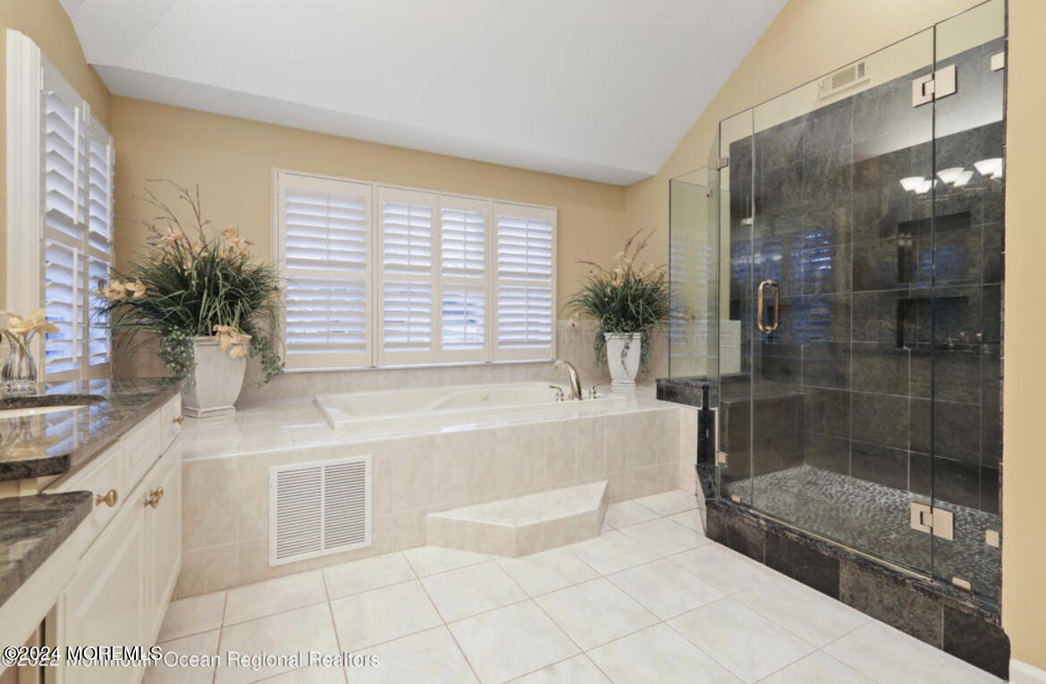 29 Northwoods Road Asbury Park, NJ 07712 - Photo 23 of 34 a bathroom with a tub shower and sink