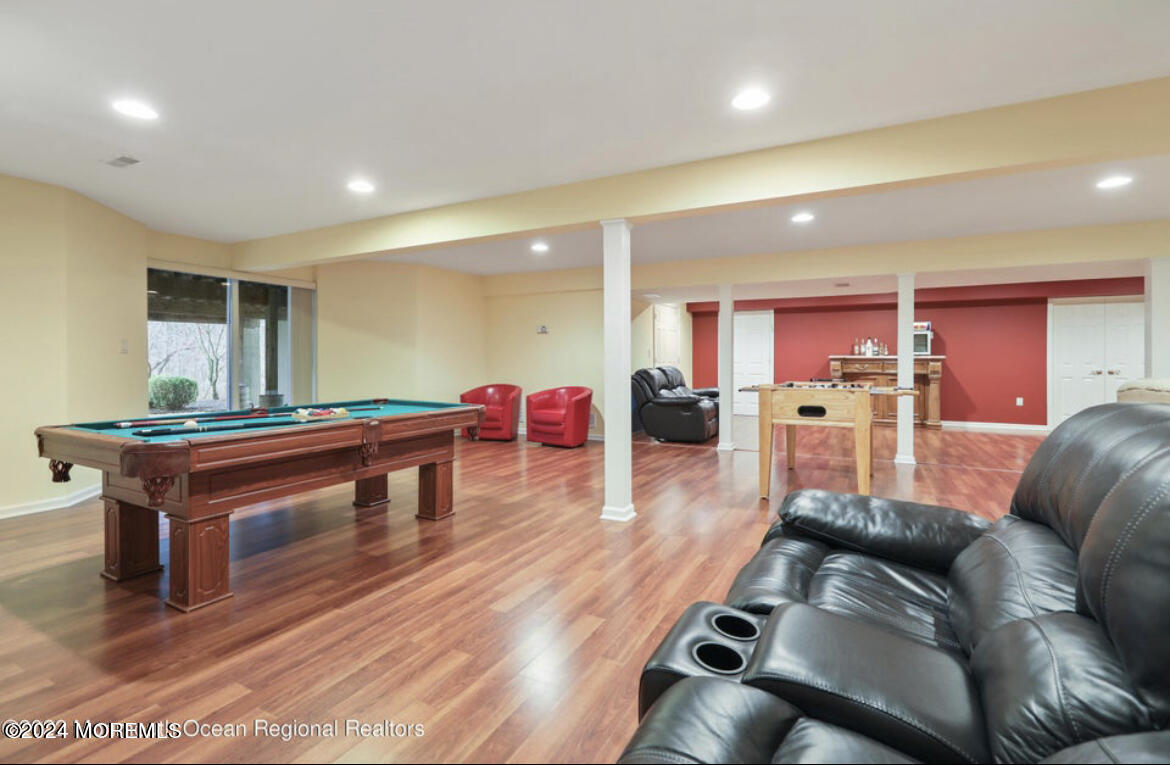 29 Northwoods Road Asbury Park, NJ 07712 - Photo 27 of 34 a living room with furniture and a wooden floor