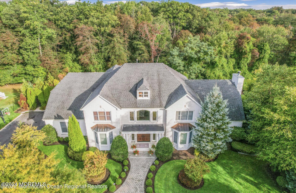 29 Northwoods Road Asbury Park, NJ 07712 - Photo 33 of 34 a aerial view of a house with swimming pool and large trees
