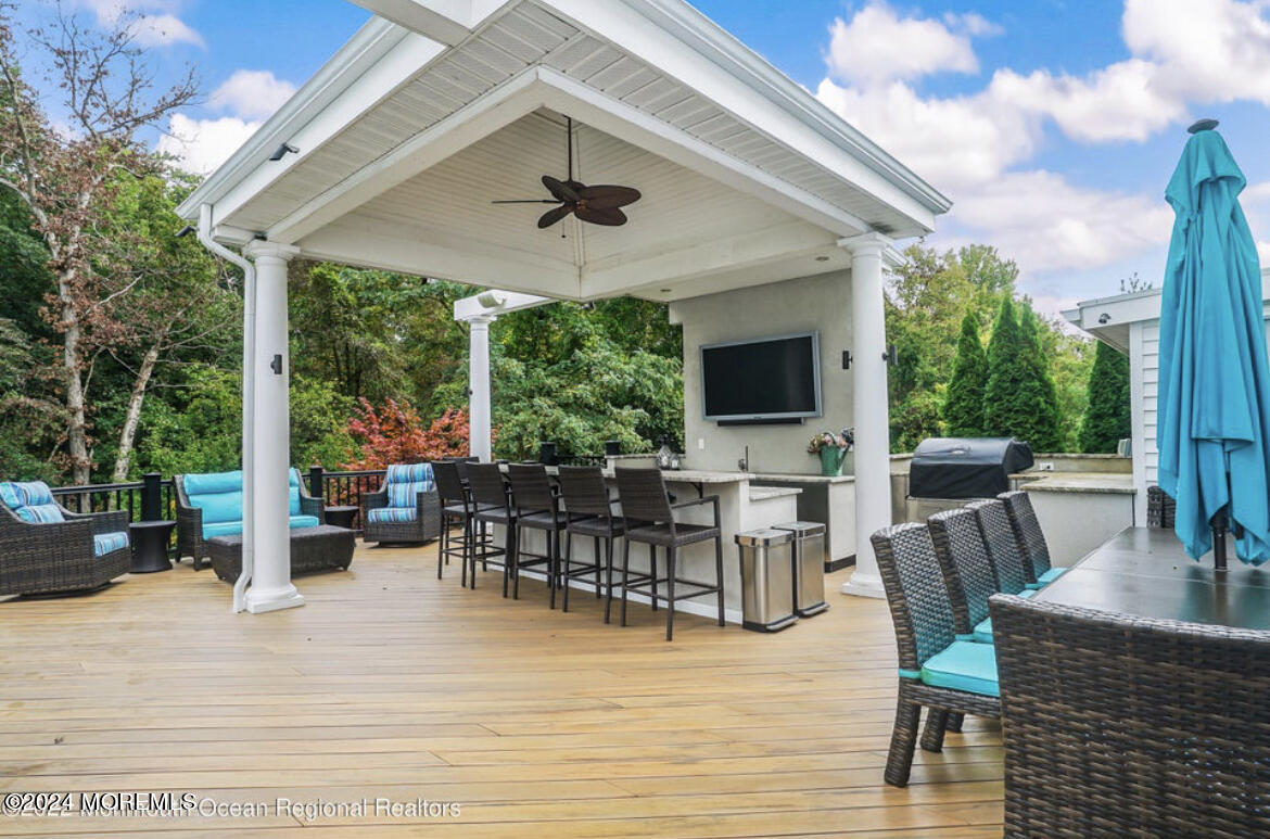 29 Northwoods Road Asbury Park, NJ 07712 - Photo 8 of 34 a view of a patio with dining table and chairs