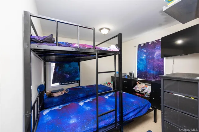 a room with bed and wooden floor