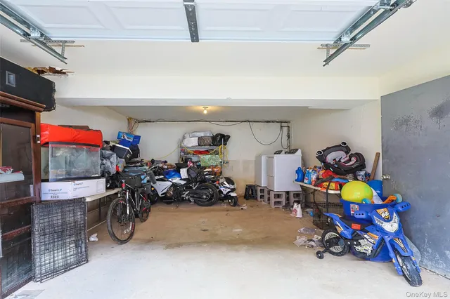 a front view of a house with a garden and sitting area