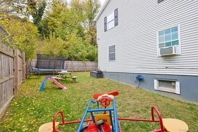 a front view of a house with a yard and a garage