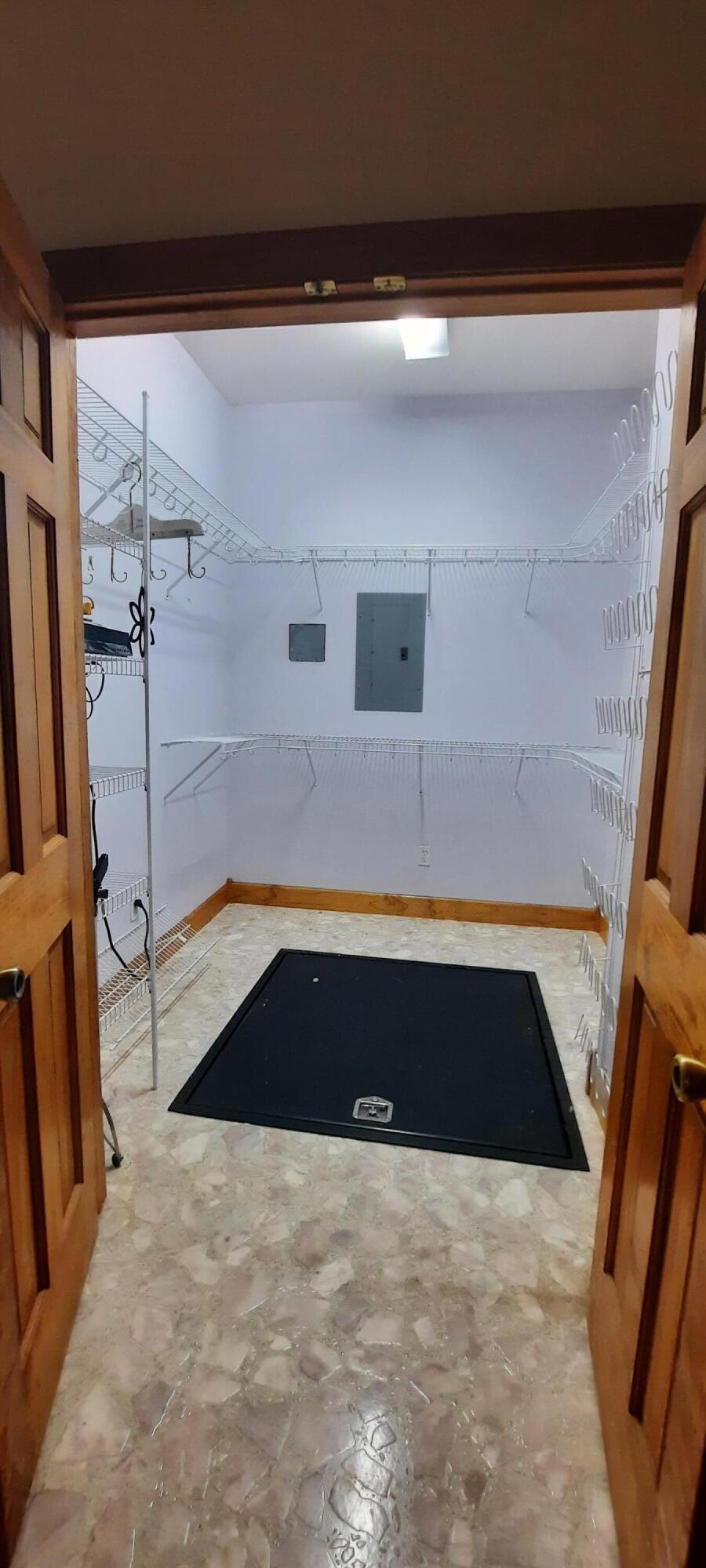 2619 County Farm Road London, KY 40741 - Photo 26 of 53 Primary walkin closet with storm shelter entrance.