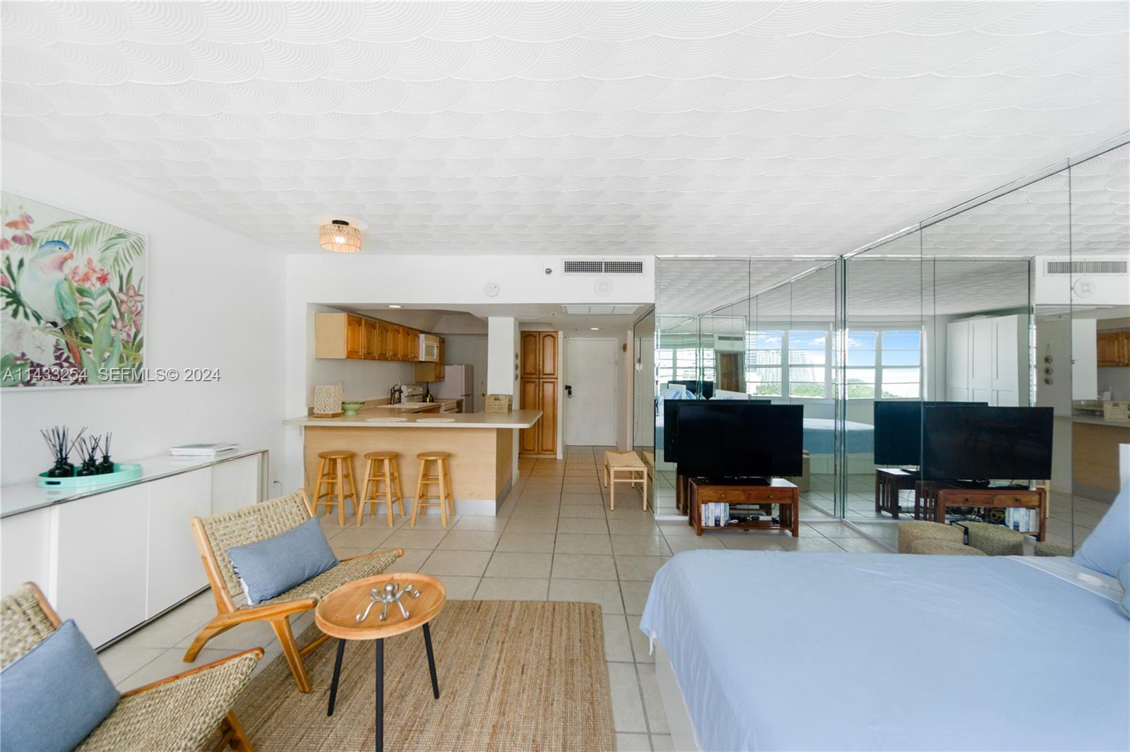 100 Lincoln Road, Unit 1039 Miami Beach, FL 33139 - Photo 7 of 26 a living room with furniture and a flat screen tv