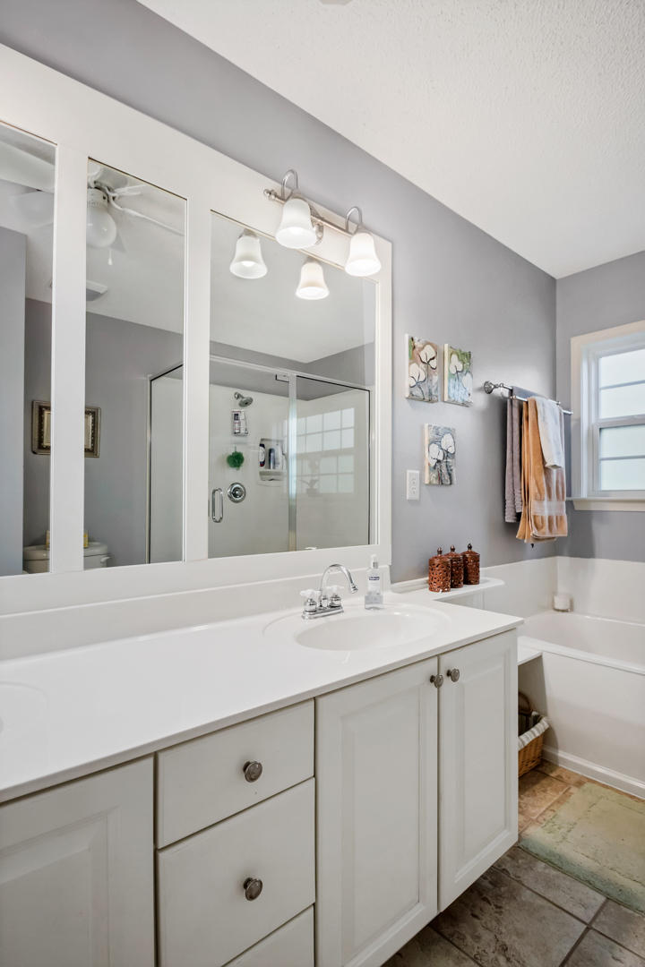 1830 Huntington Road Niceville, FL 32578 - Photo 21 of 35 a bathroom with a sink vanity and mirror
