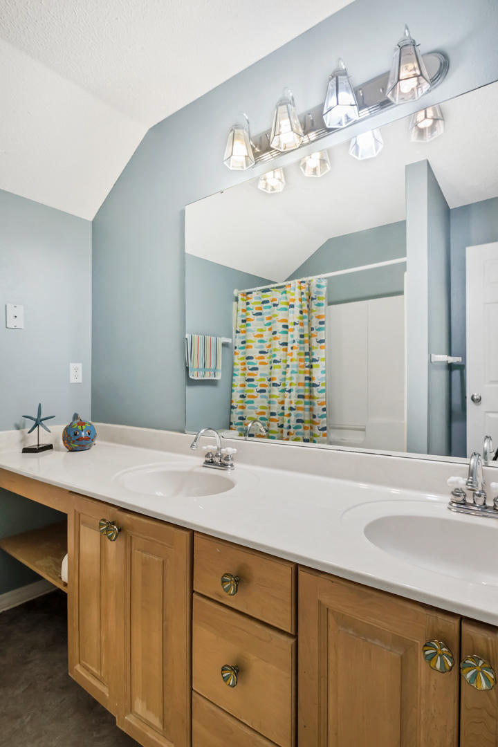1830 Huntington Road Niceville, FL 32578 - Photo 27 of 35 a bathroom with a sink double vanity and a mirror