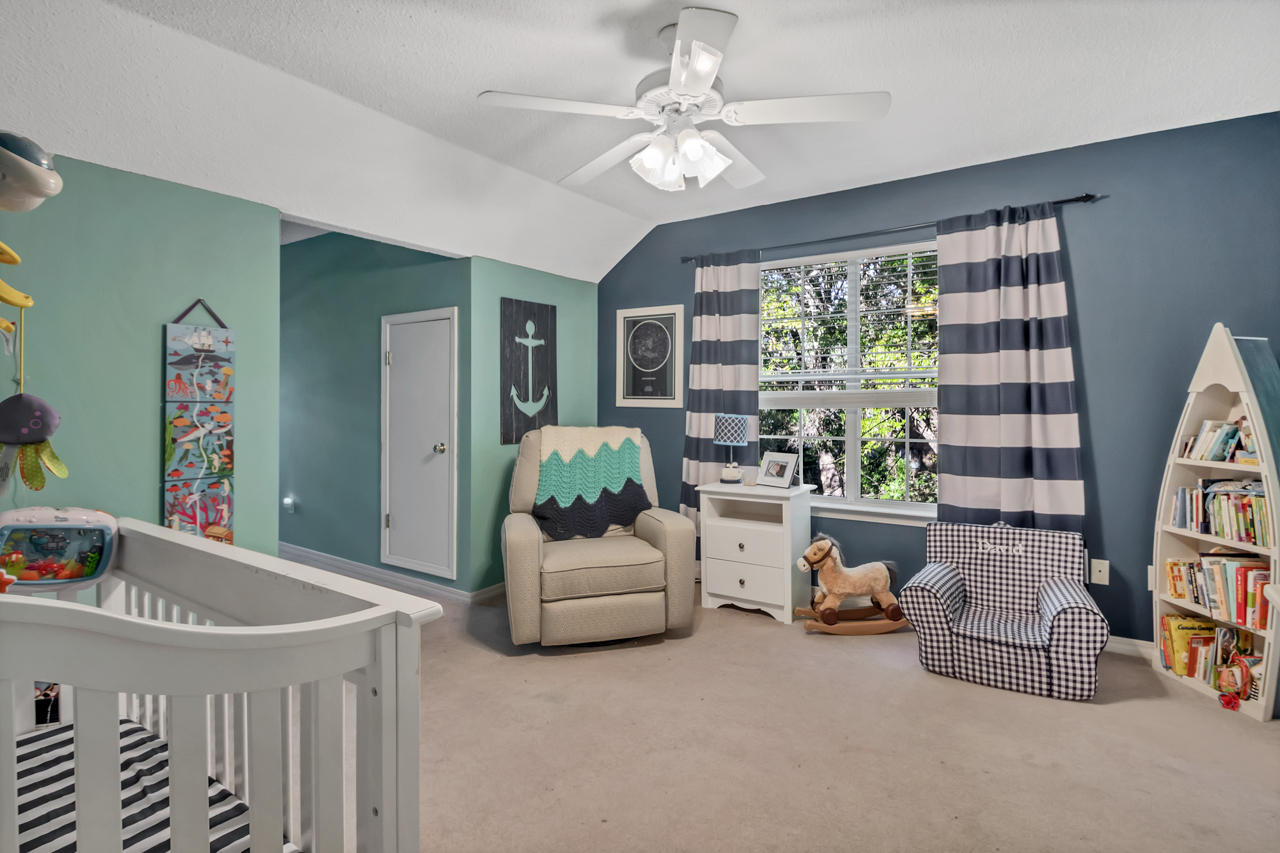 1830 Huntington Road Niceville, FL 32578 - Photo 28 of 35 a living room with furniture and a bookshelf