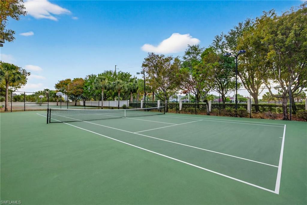 7845 Bristol Circle Naples, FL 34120 - Photo 31 of 31 a view of a tennis ground with large trees