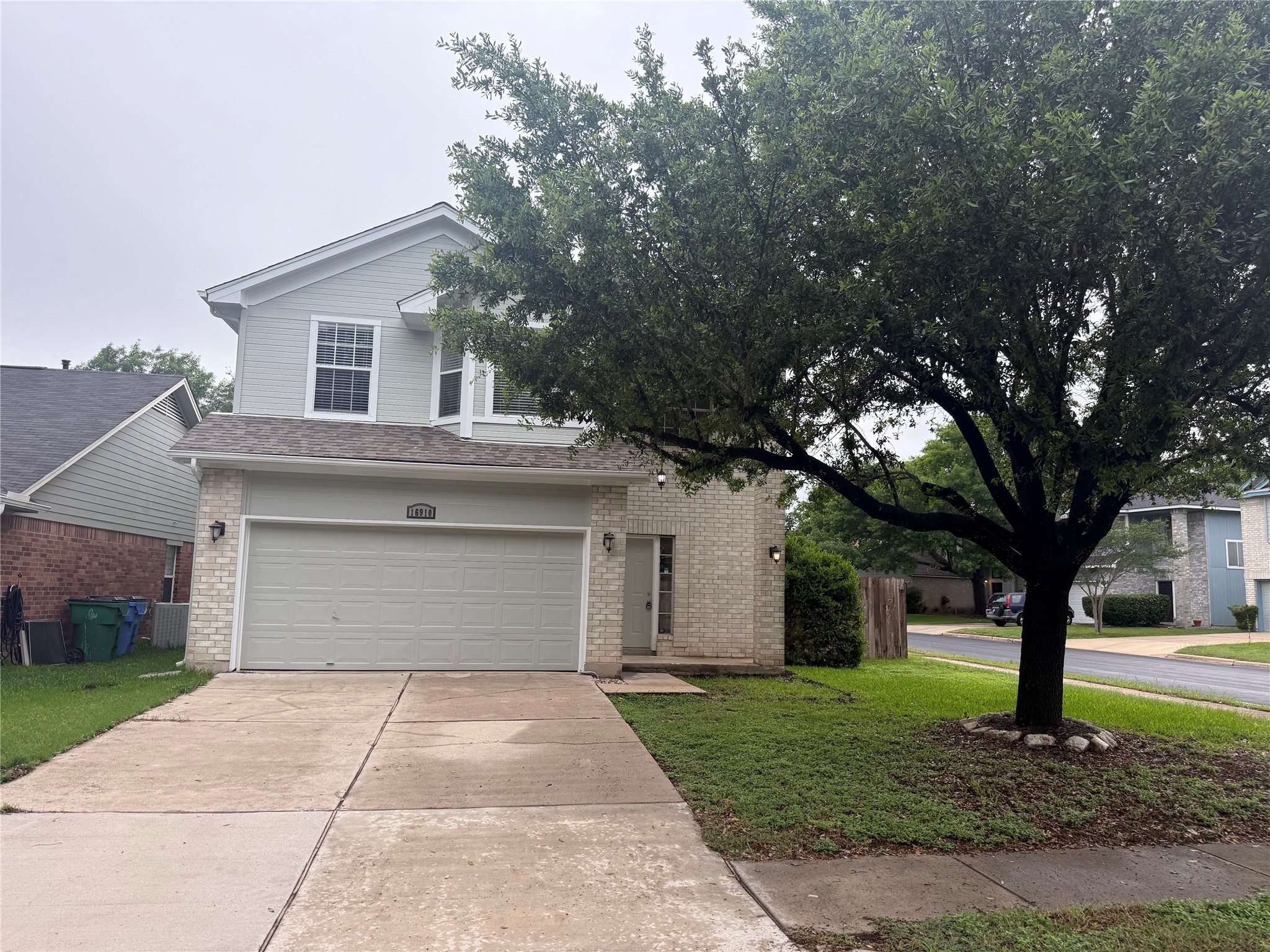 16910 Isle Of Man Road Pflugerville, TX 78660 - Photo 1 of 13 Two-story residence featuring light brick and horizontal siding