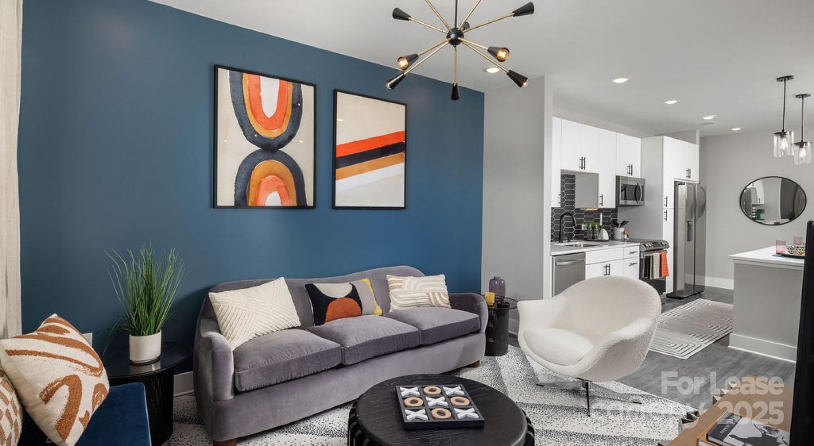 1015 North Alexander Street, Unit B5 Charlotte, NC 28206 - Photo 26 of 31 a living room with furniture a rug and kitchen view