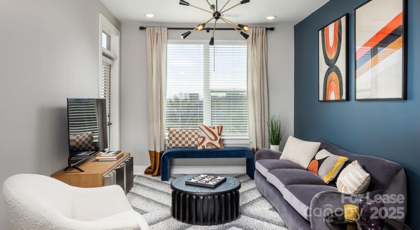 1015 North Alexander Street, Unit B5 Charlotte, NC 28206 - Photo 4 of 31 a living room with furniture and a window