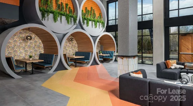 an outdoor living area with furniture and a fireplace