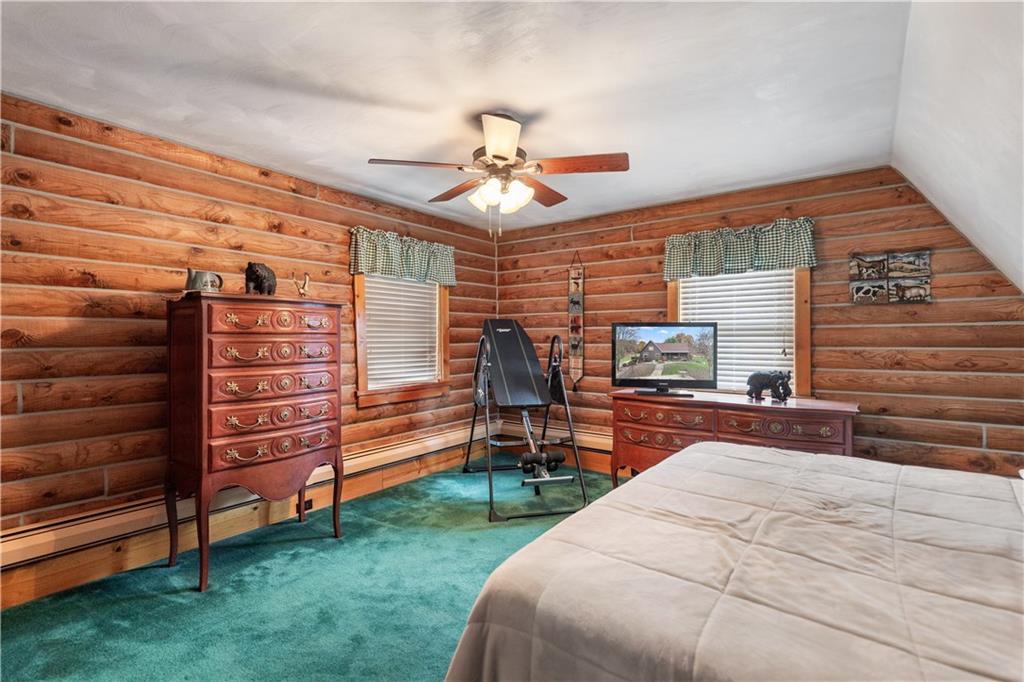 215 Shilo Ridge Drive Export, PA 15632 - Photo 19 of 48 a bedroom with a bed and a chandelier