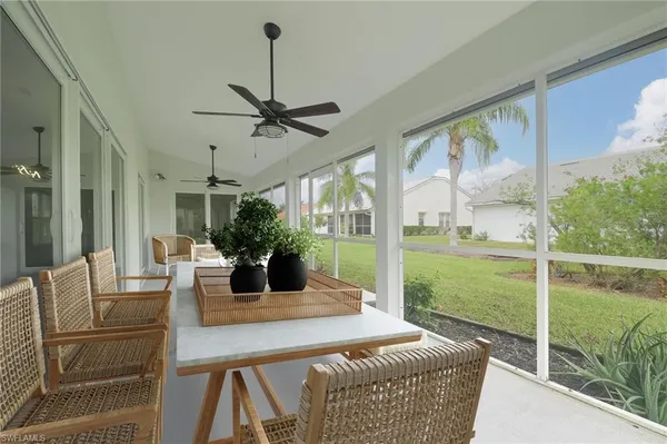 a view of a dining room with furniture window and outside view