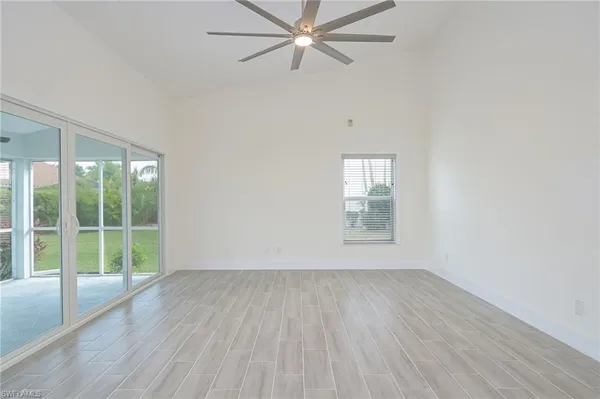 wooden floor in an empty room with a window