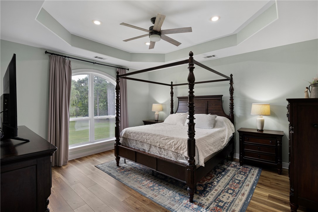 751 Walthall Road Russellville, AR 72802 - Photo 15 of 60 Spacious room featuring wood-finish flooring, a recessed ceiling with a ceiling fan, and recessed lighting