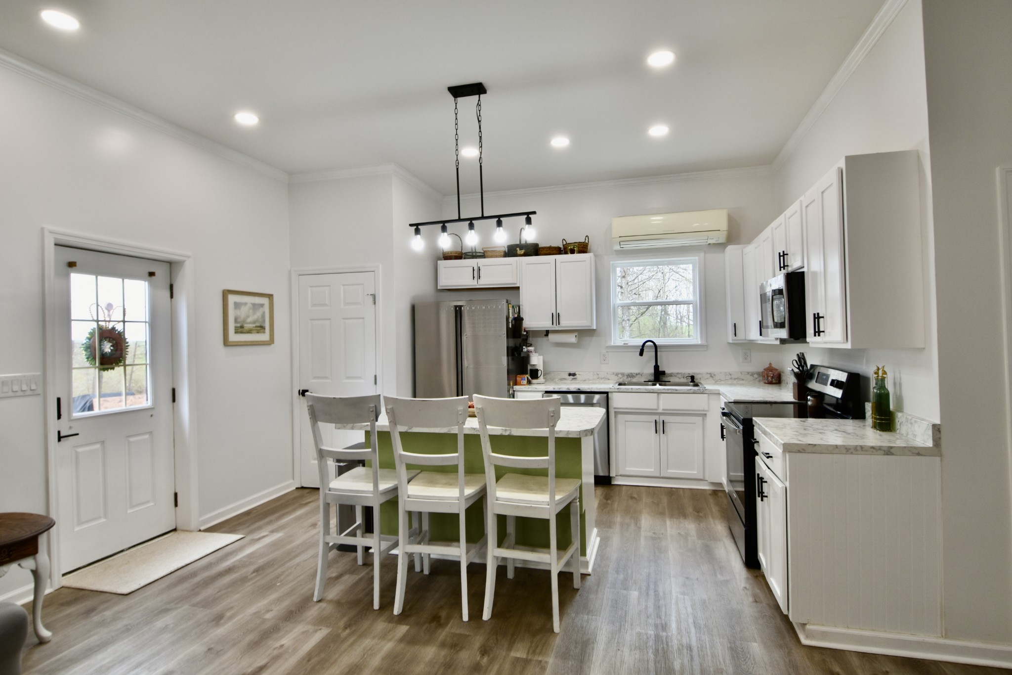412 Eells Street Loretto, TN 38469 - Photo 11 of 19 a view of a dining room with furniture window and wooden floor