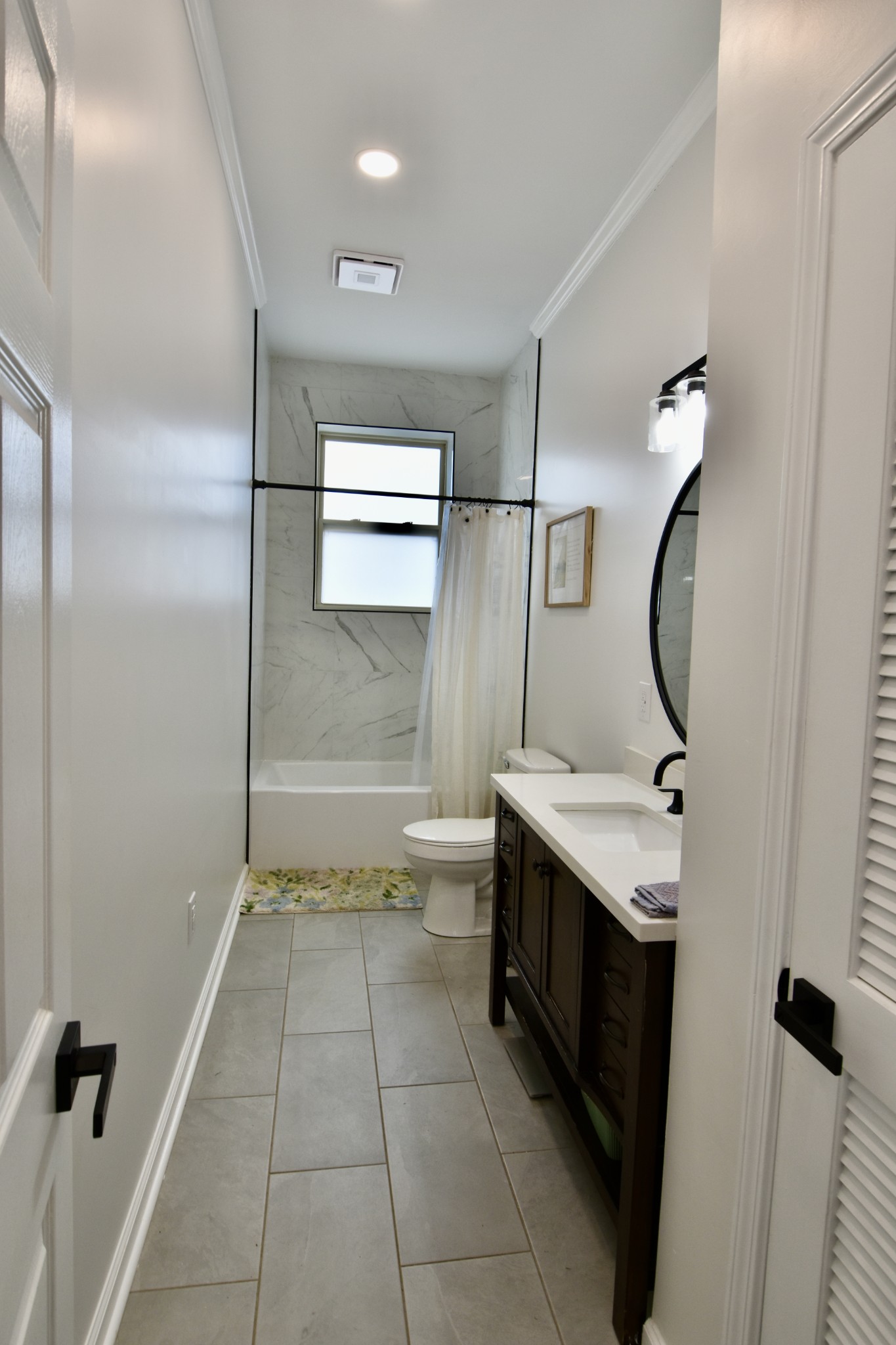 412 Eells Street Loretto, TN 38469 - Photo 19 of 19 a bathroom with a granite countertop sink toilet and shower