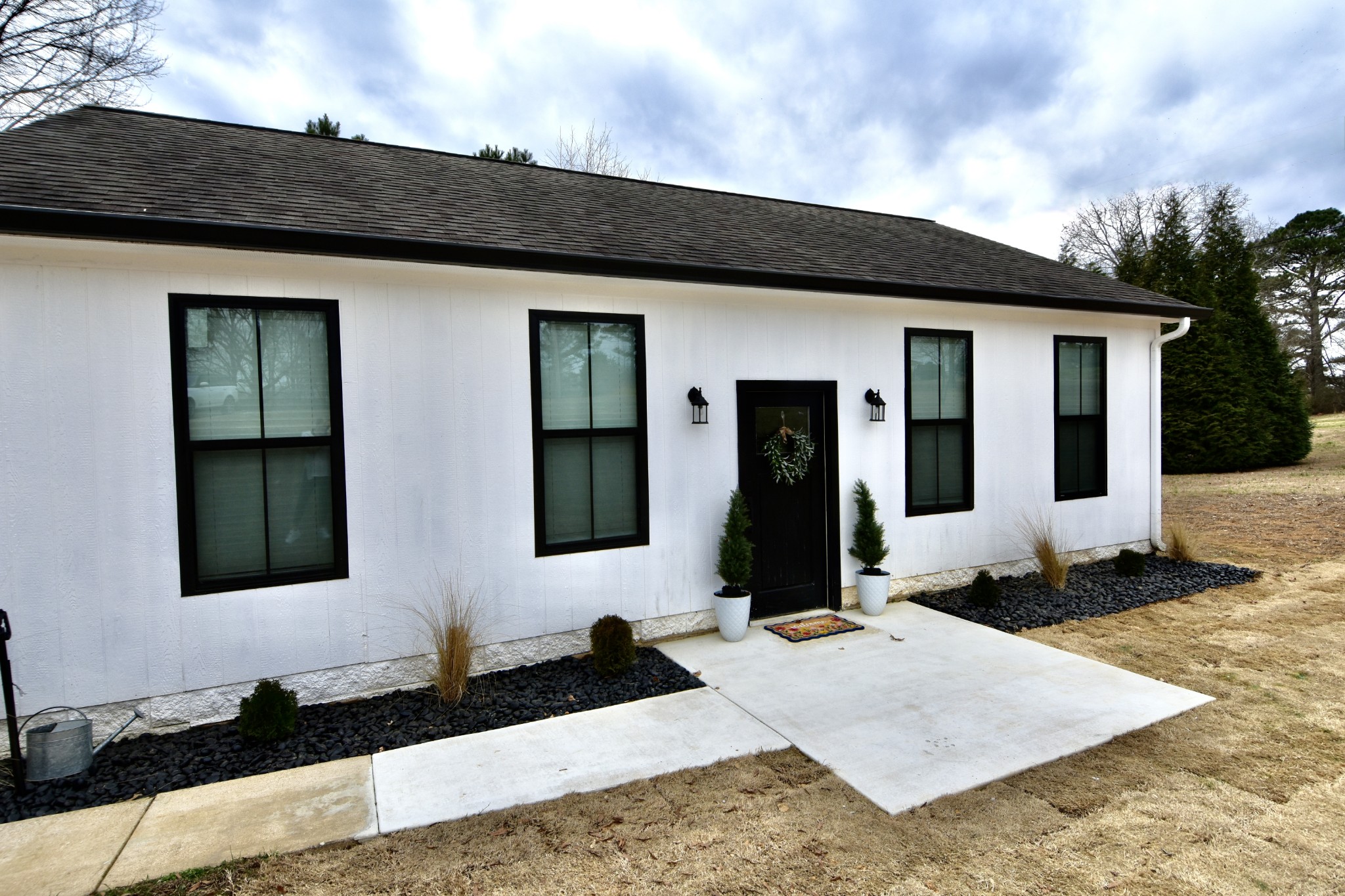412 Eells Street Loretto, TN 38469 - Photo 3 of 19 a front view of a house with windows