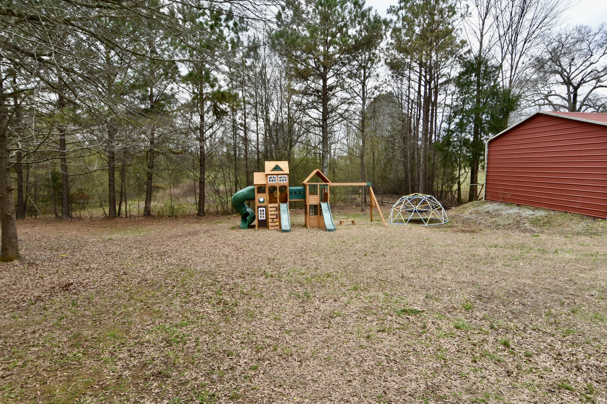 412 Eells Street Loretto, TN 38469 - Photo 6 of 19 a view of backyard with table and chairs