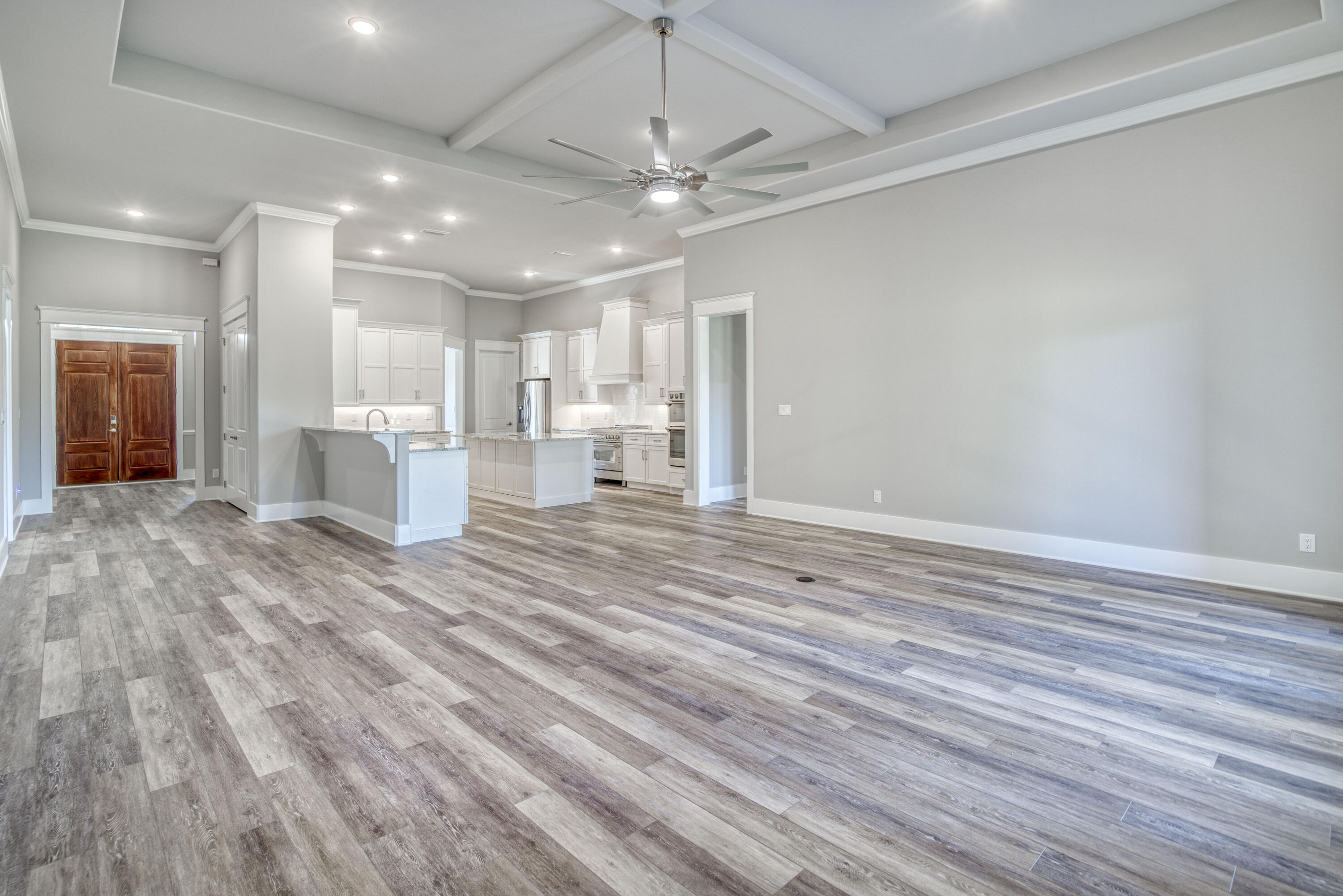2864 P.G.A Boulevard Navarre, FL 32566 - Photo 12 of 52 a view of a room with wooden floor and windows