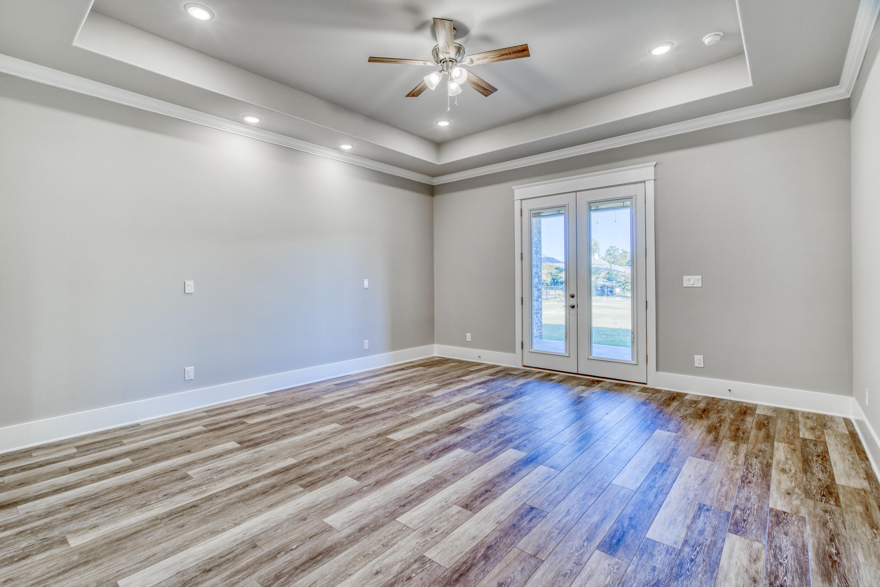 2864 P.G.A Boulevard Navarre, FL 32566 - Photo 18 of 52 wooden floor in an empty room with a window