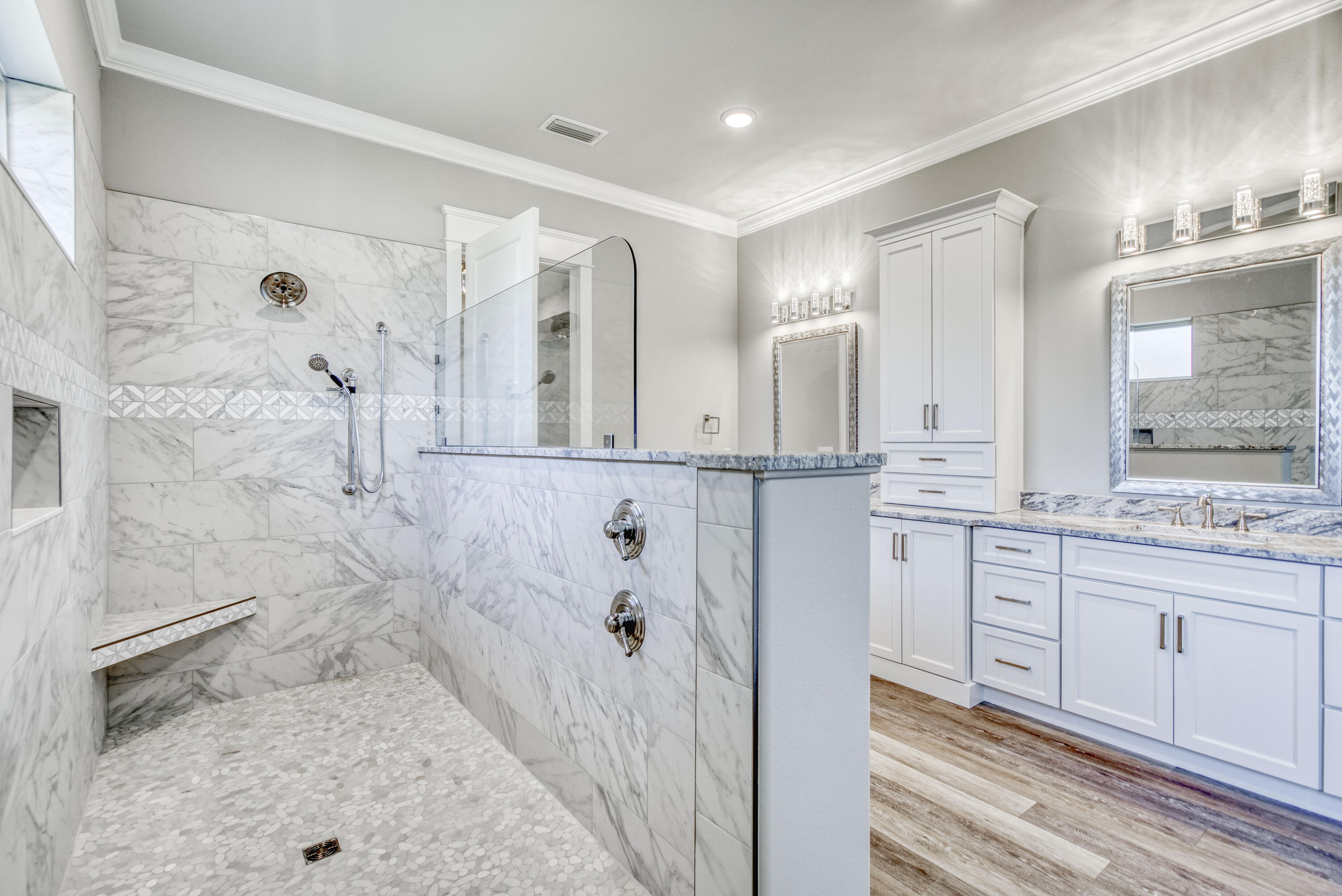 2864 P.G.A Boulevard Navarre, FL 32566 - Photo 22 of 52 a bathroom with a granite countertop sink a mirror and a shower