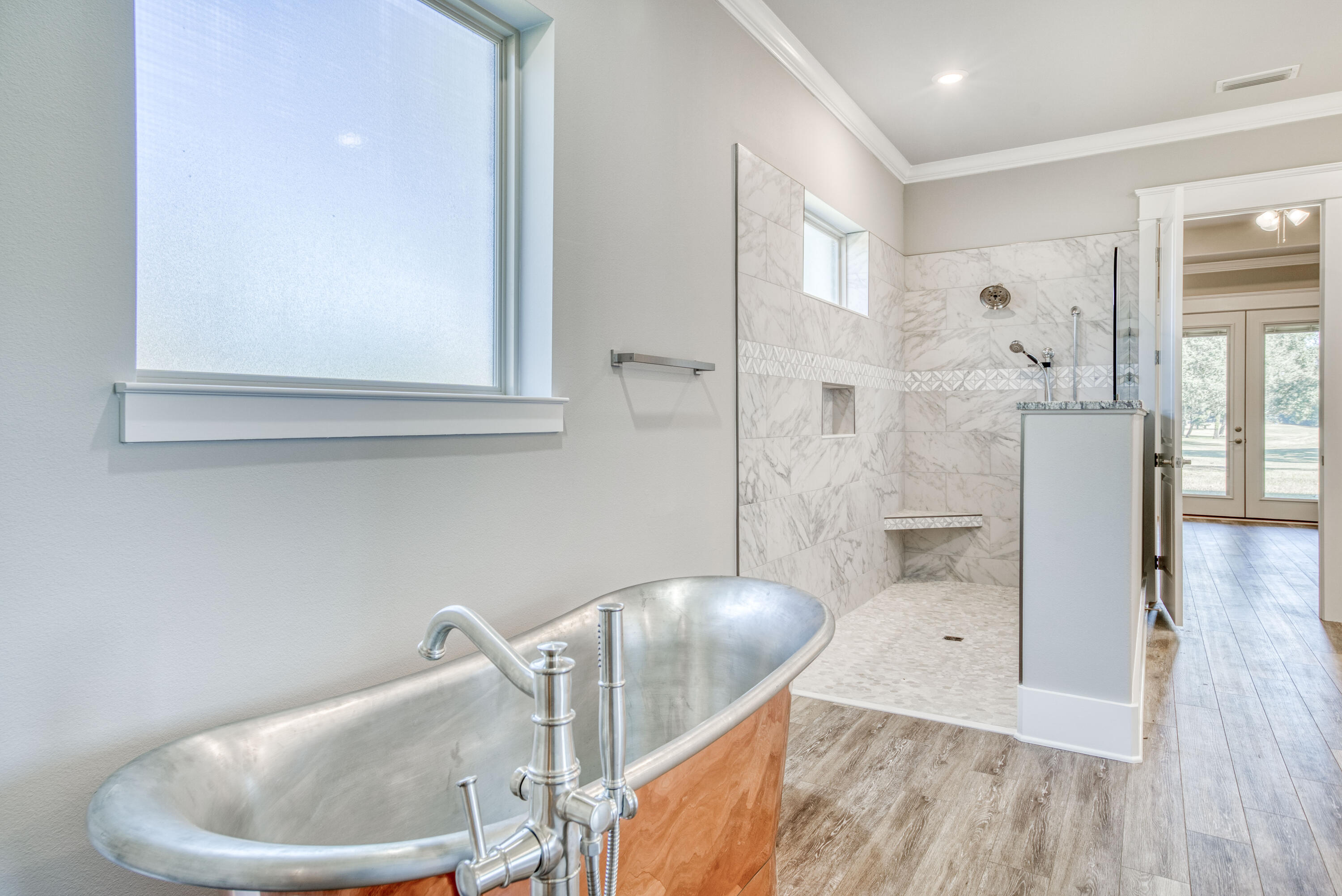 2864 P.G.A Boulevard Navarre, FL 32566 - Photo 23 of 52 a living room with furniture and a wooden floor