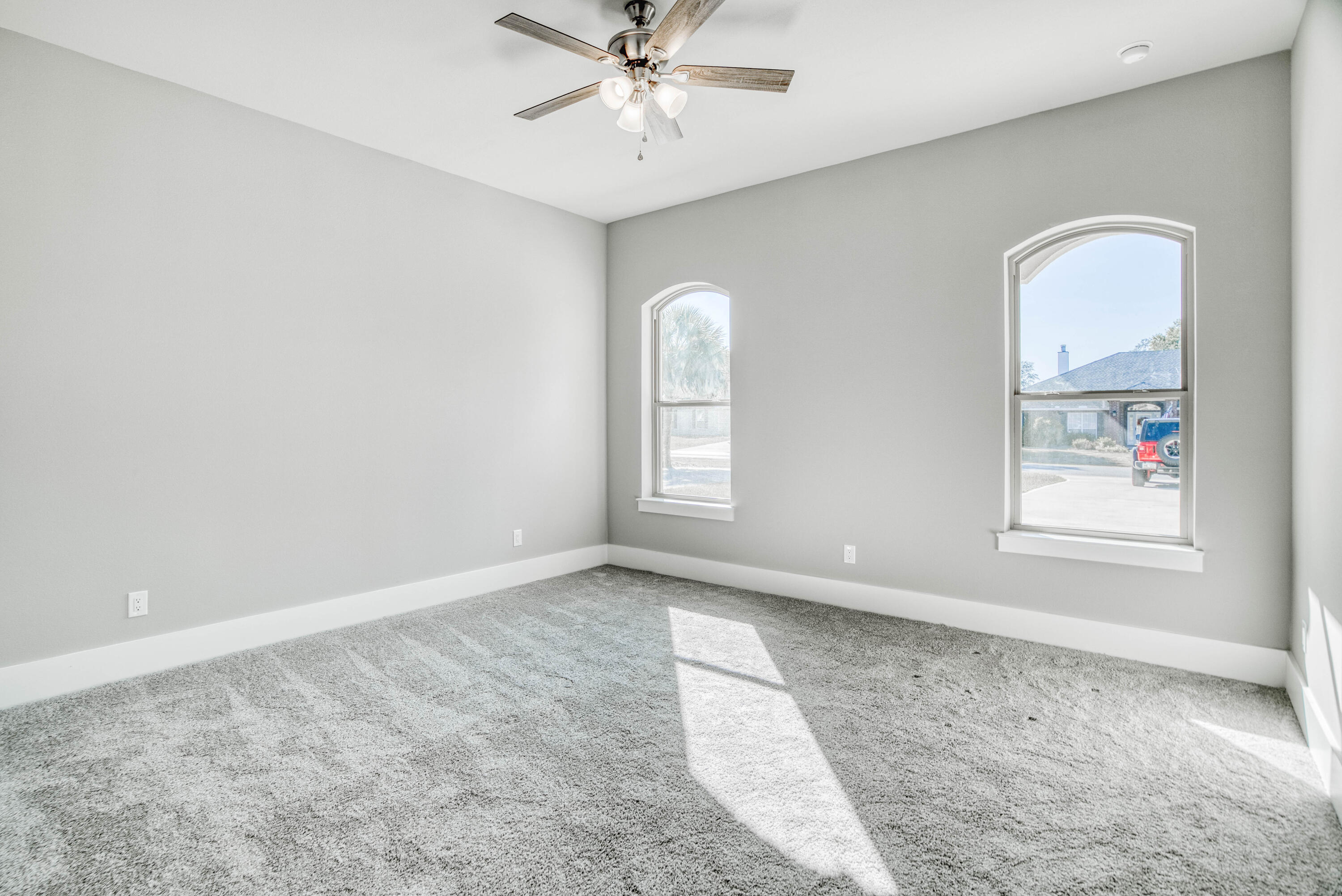 2864 P.G.A Boulevard Navarre, FL 32566 - Photo 26 of 52 an empty room with windows and fan