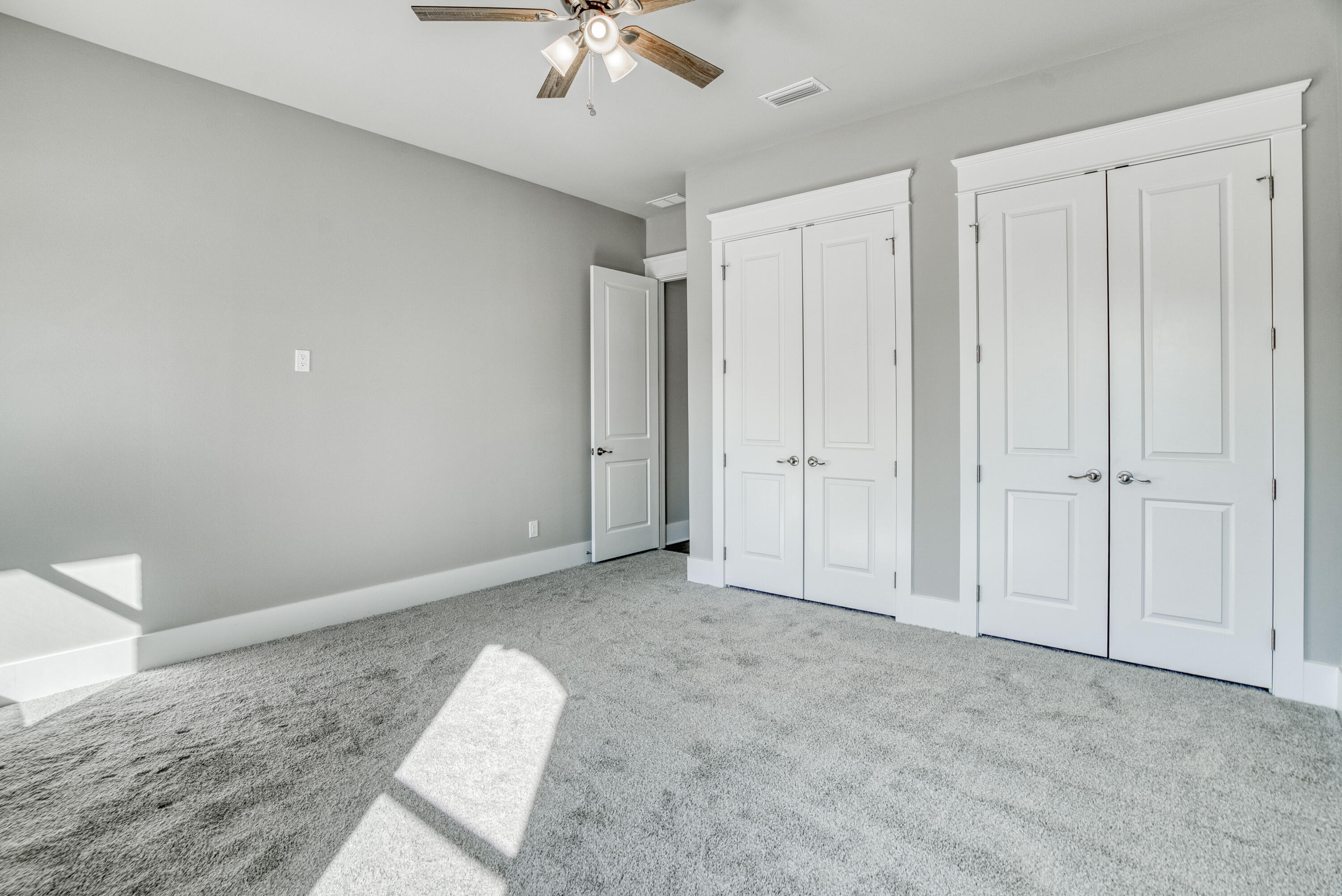 2864 P.G.A Boulevard Navarre, FL 32566 - Photo 27 of 52 an empty room with chandelier fan