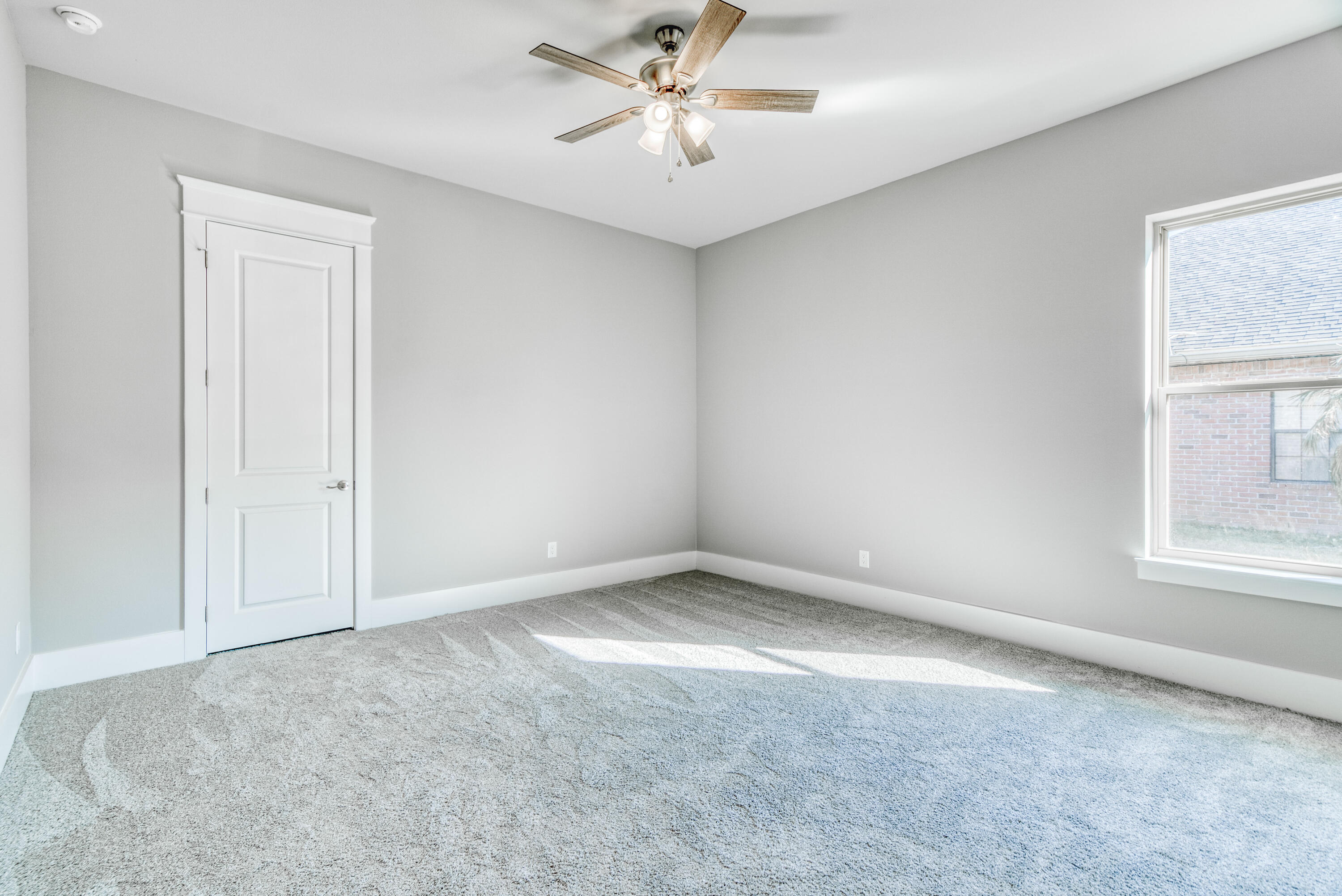 2864 P.G.A Boulevard Navarre, FL 32566 - Photo 29 of 52 an empty room with windows and fan