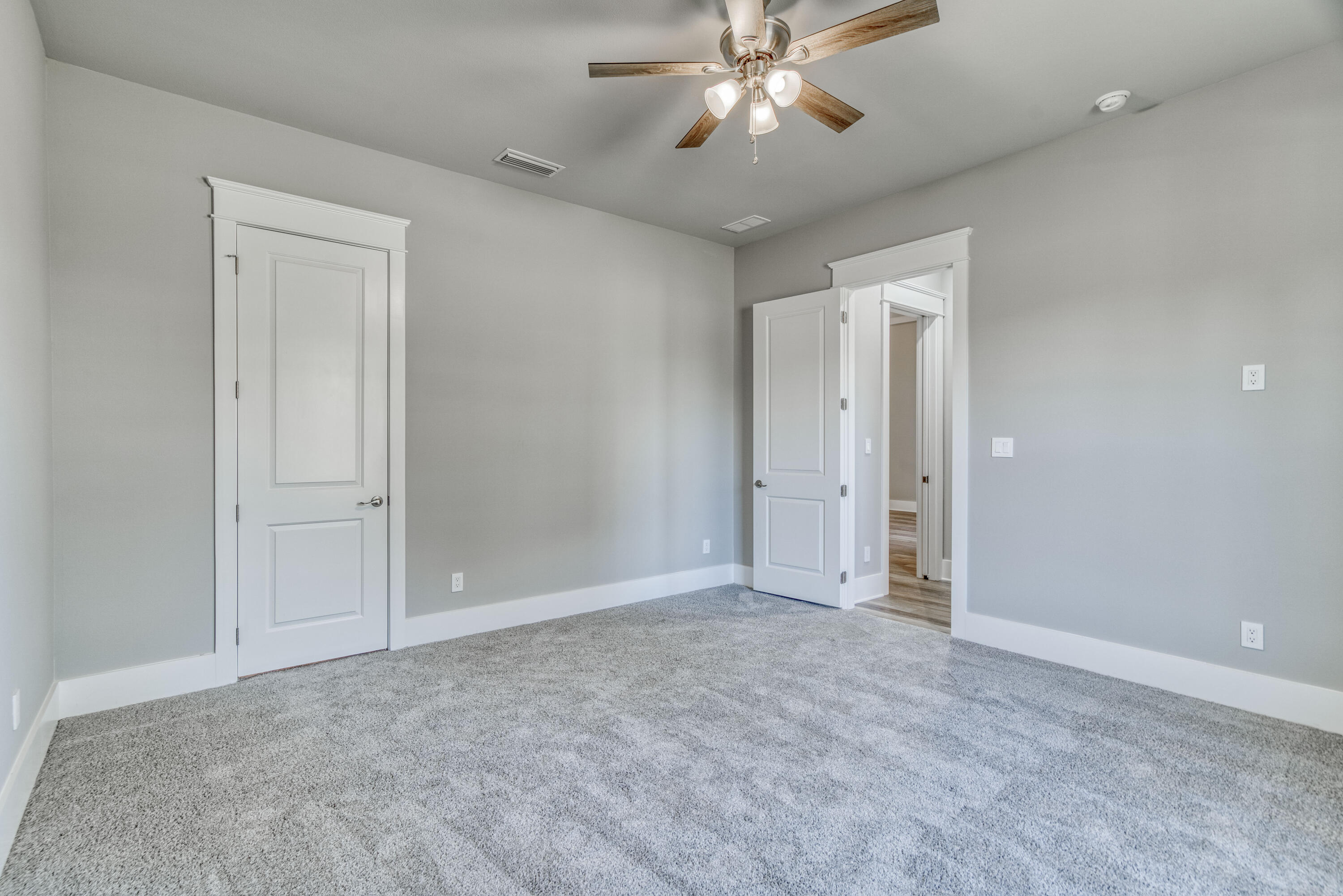 2864 P.G.A Boulevard Navarre, FL 32566 - Photo 32 of 52 wooden floor in an empty room