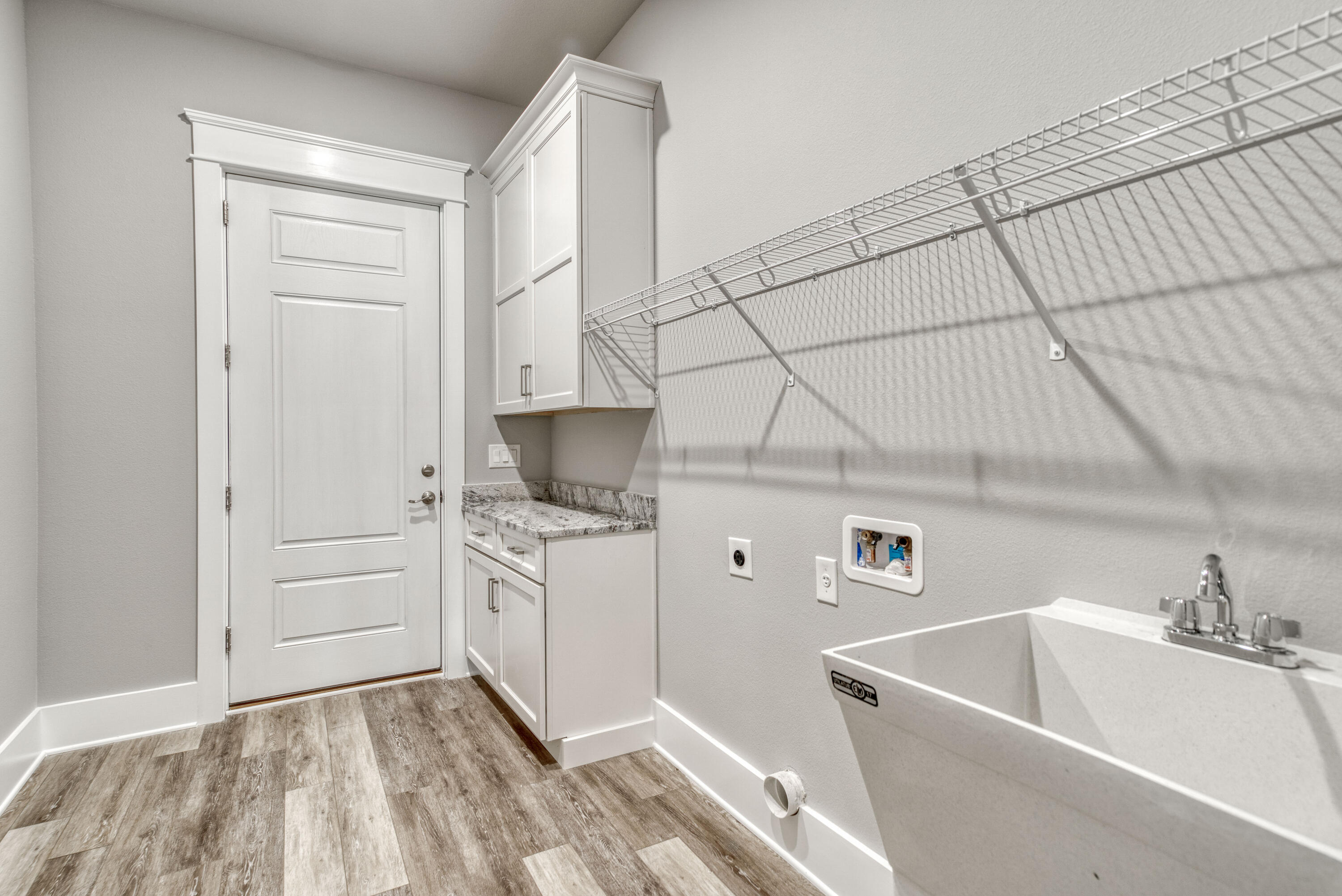 2864 P.G.A Boulevard Navarre, FL 32566 - Photo 35 of 52 a kitchen with a sink a stove and refrigerator