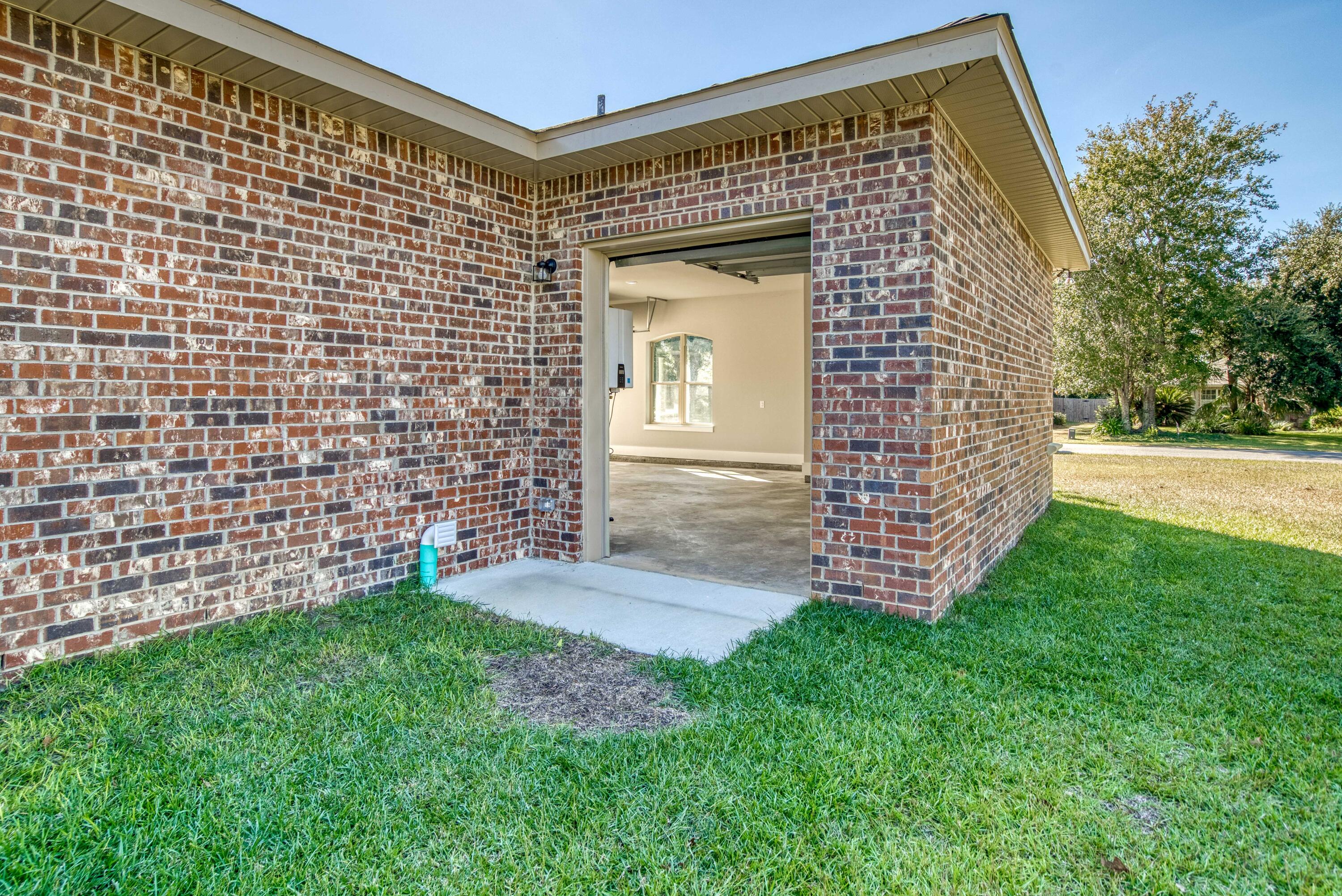 2864 P.G.A Boulevard Navarre, FL 32566 - Photo 38 of 52 a view of a back yard of the house