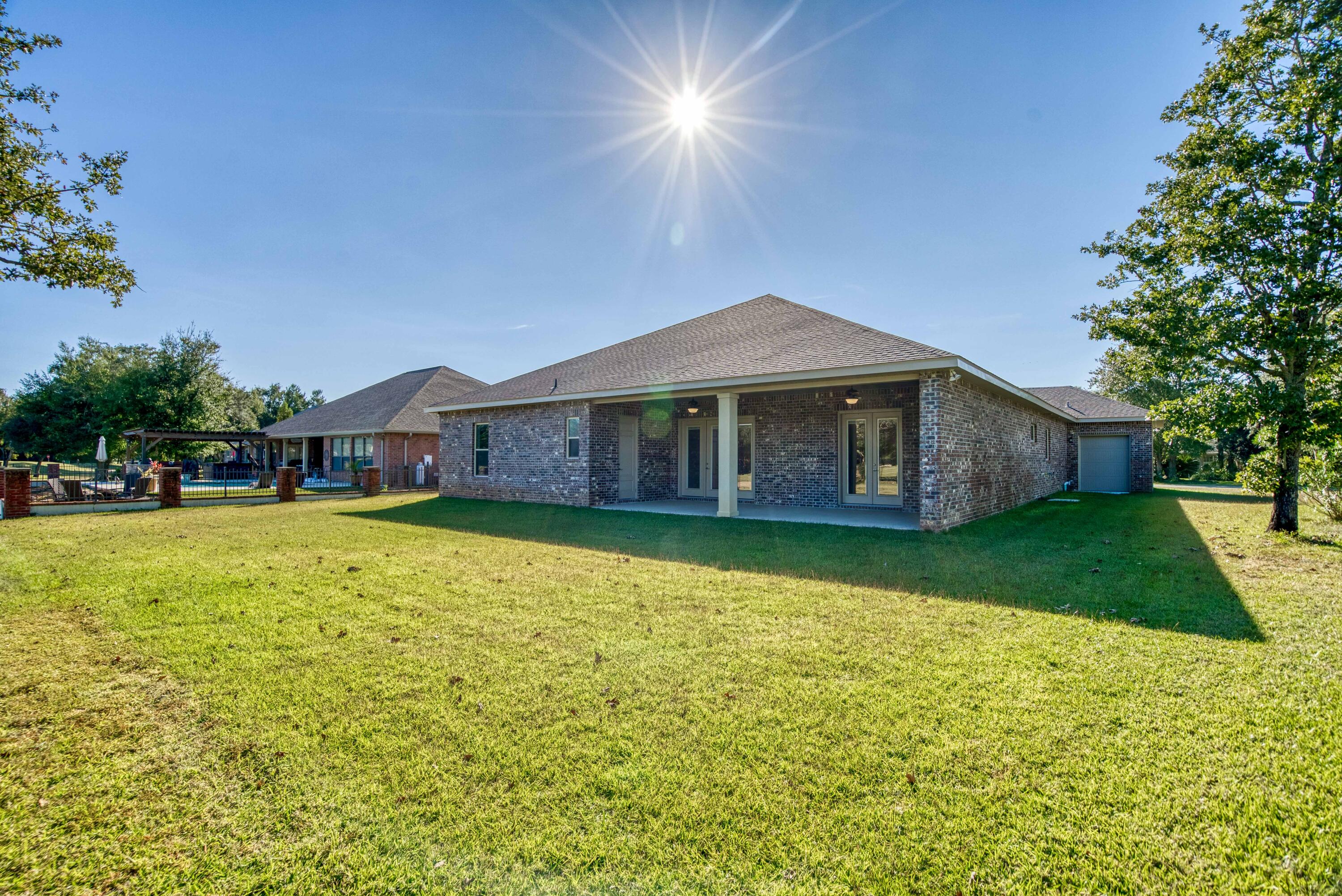 2864 P.G.A Boulevard Navarre, FL 32566 - Photo 39 of 52 a front view of a house with a yard