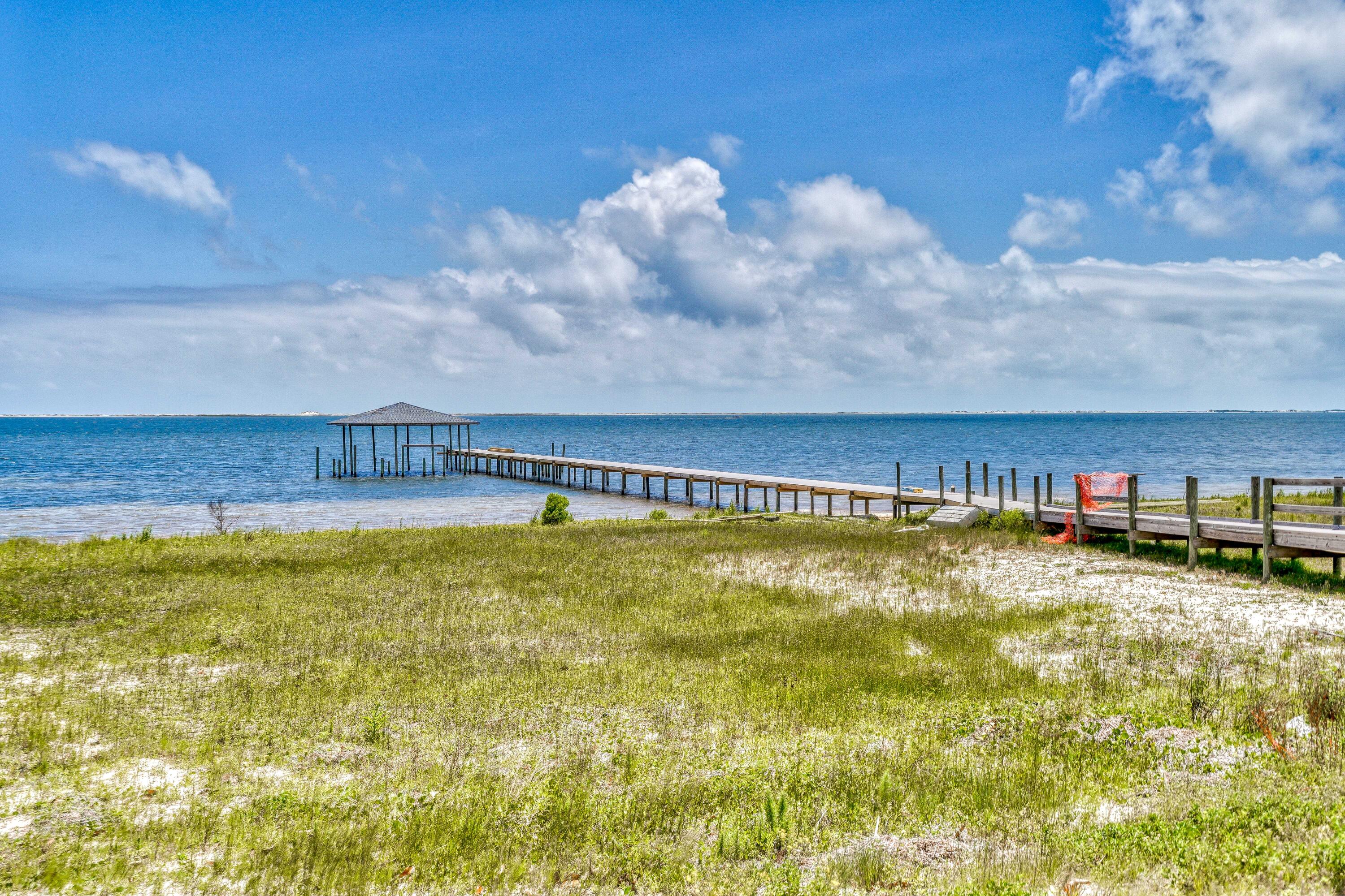 2864 P.G.A Boulevard Navarre, FL 32566 - Photo 45 of 52 a view of a swimming pool with an outdoor space and seating area