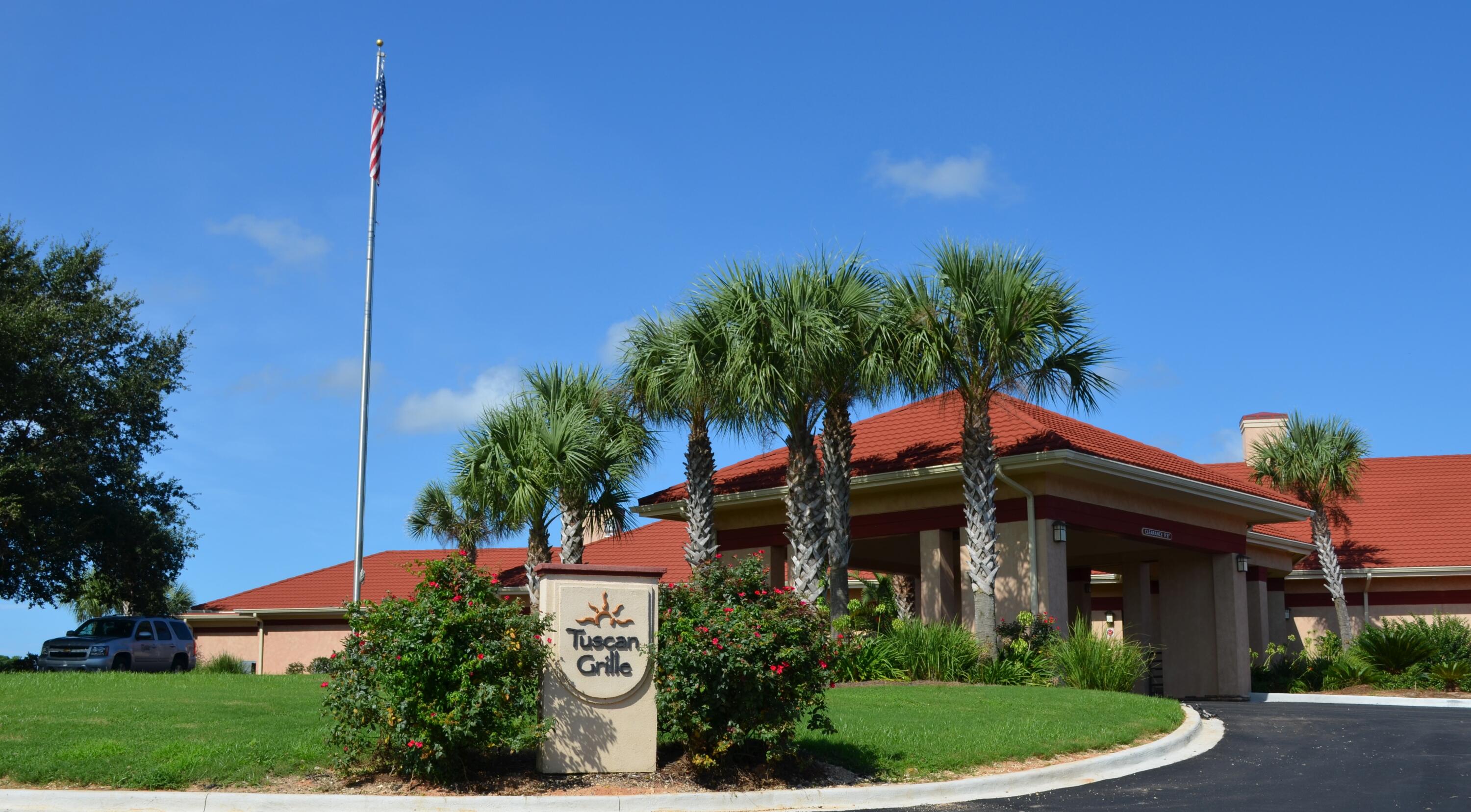 2864 P.G.A Boulevard Navarre, FL 32566 - Photo 50 of 52 a view of a house with a yard and potted plants