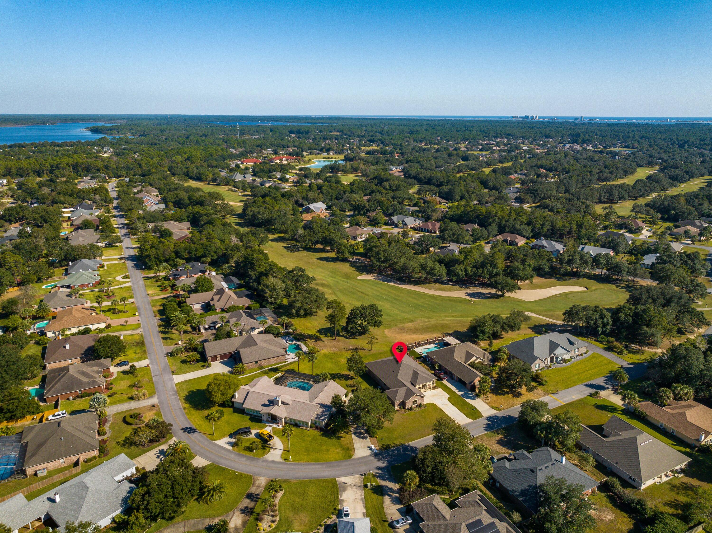 2864 P.G.A Boulevard Navarre, FL 32566 - Photo 6 of 52 an aerial view of residential houses with outdoor space