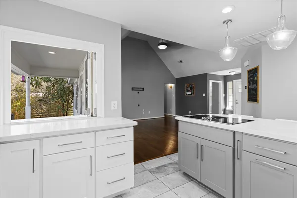 a bathroom with a sink vanity and mirror