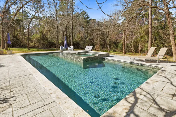 a view of a swimming pool with a patio
