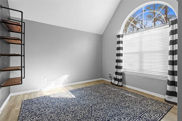 a view of a livingroom with a book shelf