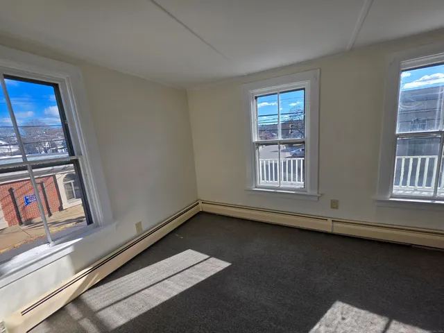 a view of an empty room with windows