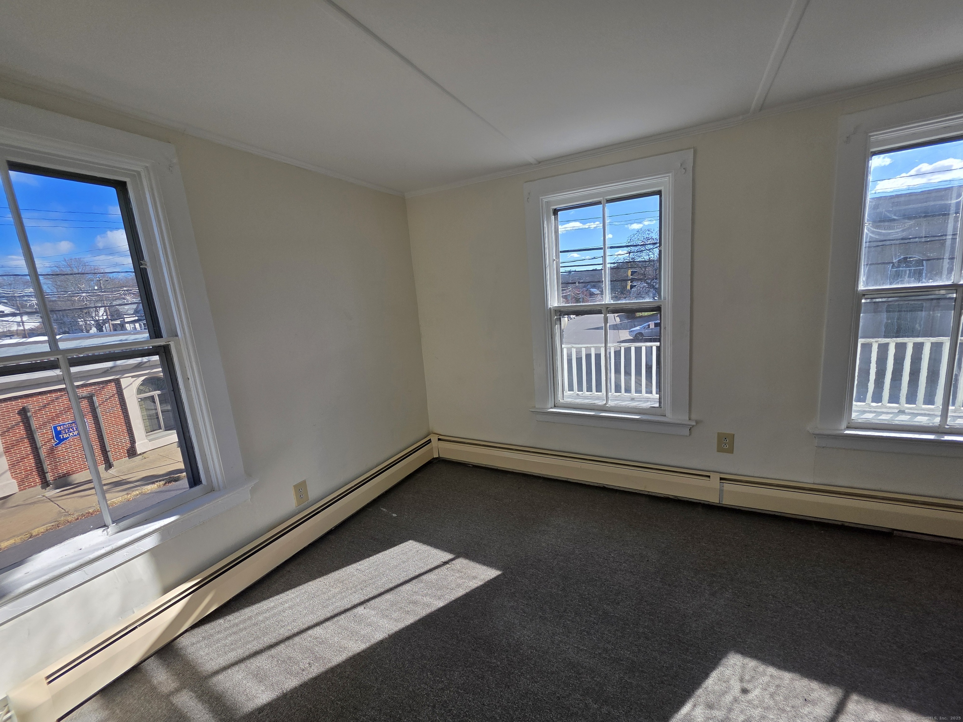 110 Main Street Griswold, CT 06351 - Photo 11 of 32 a view of an empty room with windows