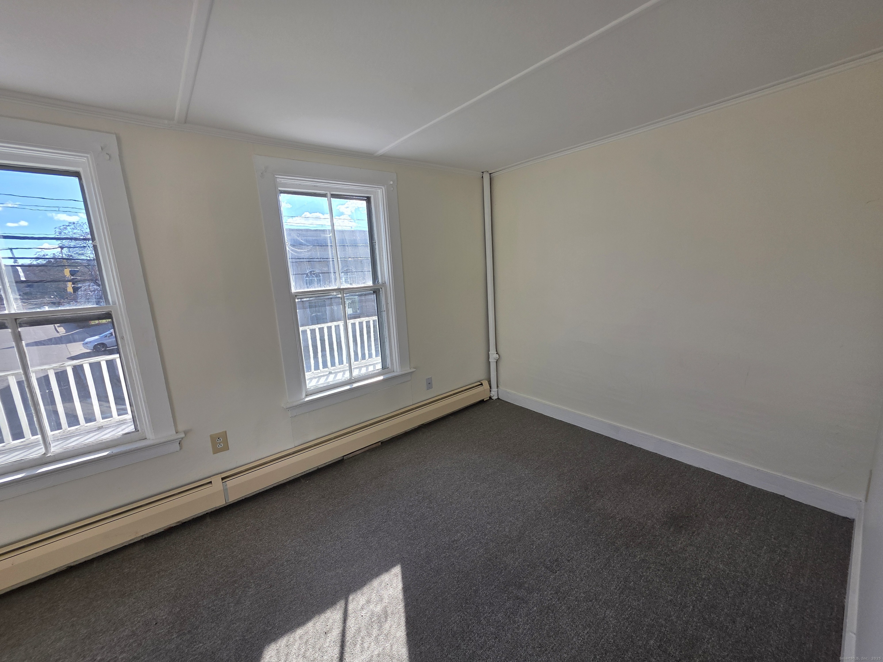 110 Main Street Griswold, CT 06351 - Photo 12 of 32 a view of an empty room with a window