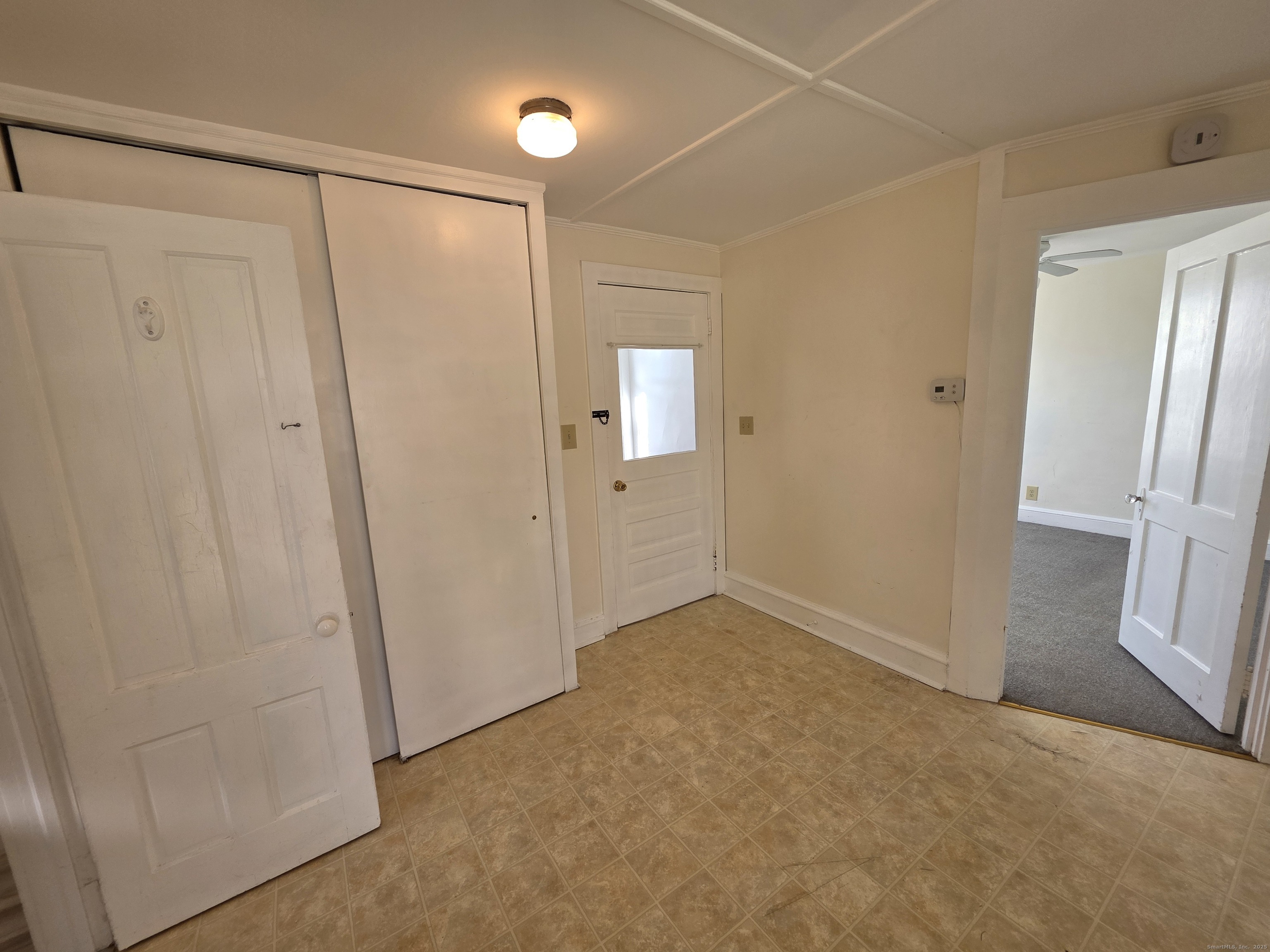 110 Main Street Griswold, CT 06351 - Photo 13 of 32 a view of an empty room with a mirror