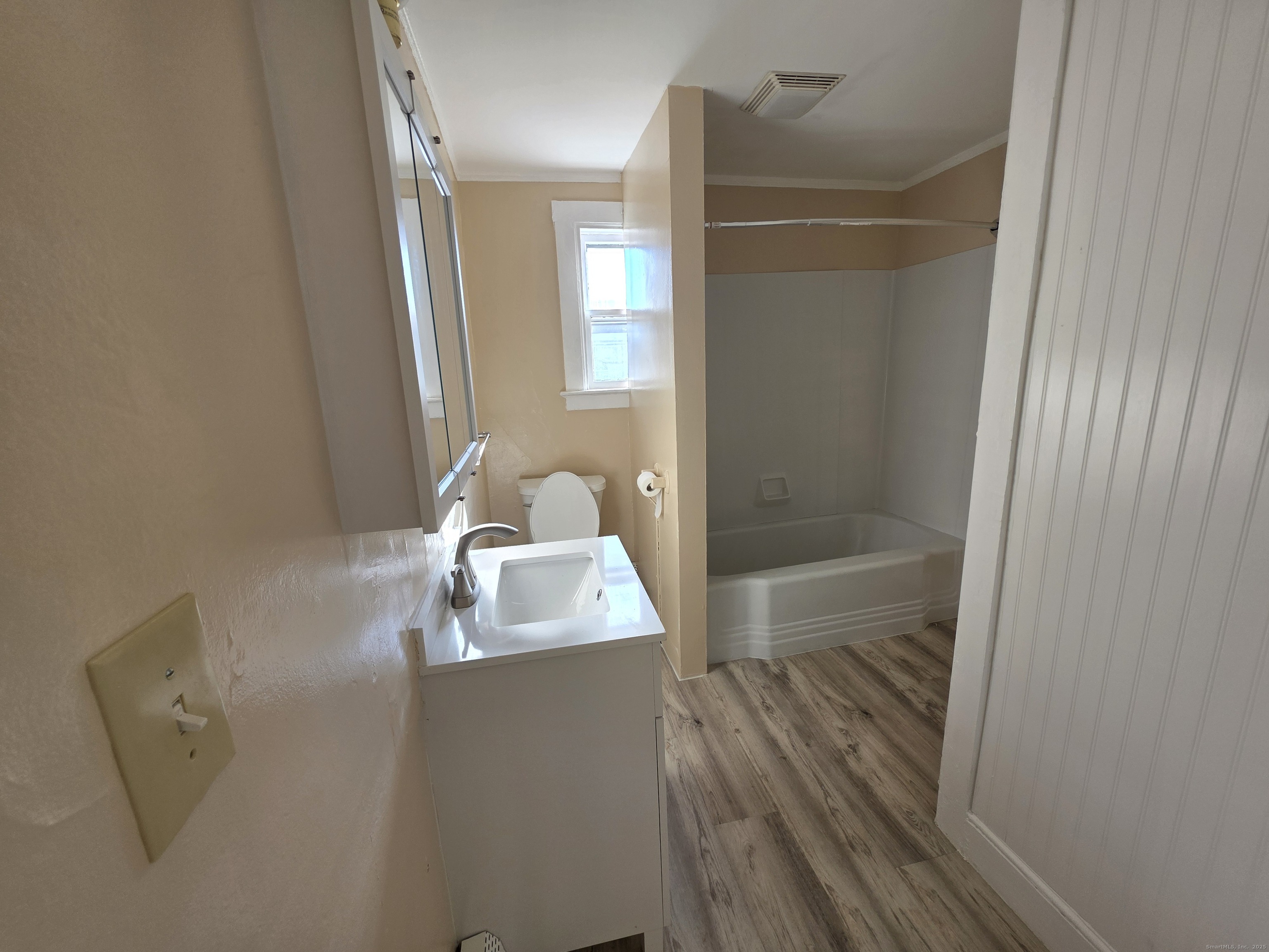 110 Main Street Griswold, CT 06351 - Photo 14 of 32 a bathroom with a sink a toilet and shower