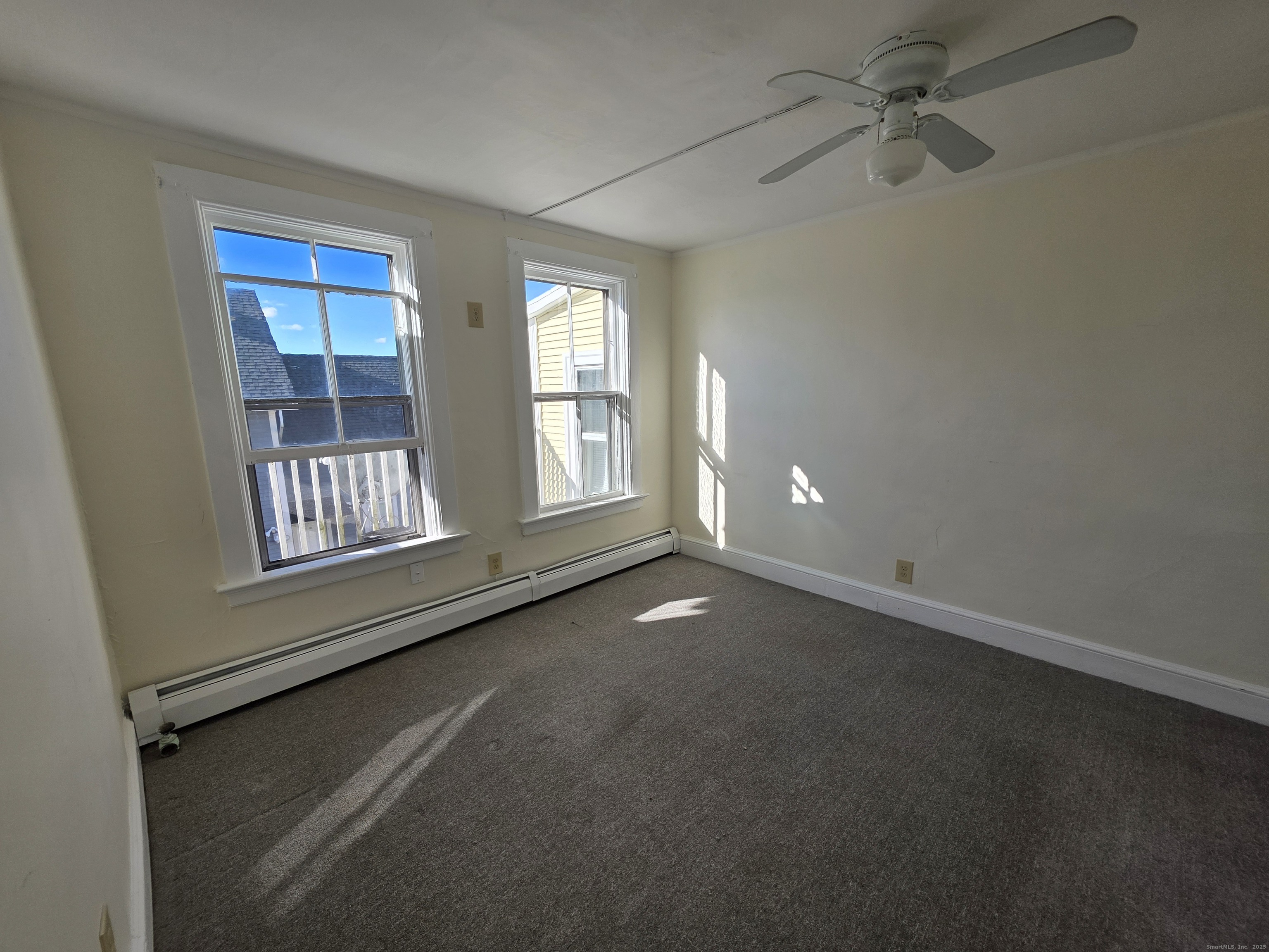 110 Main Street Griswold, CT 06351 - Photo 16 of 32 a view of an empty room with a window