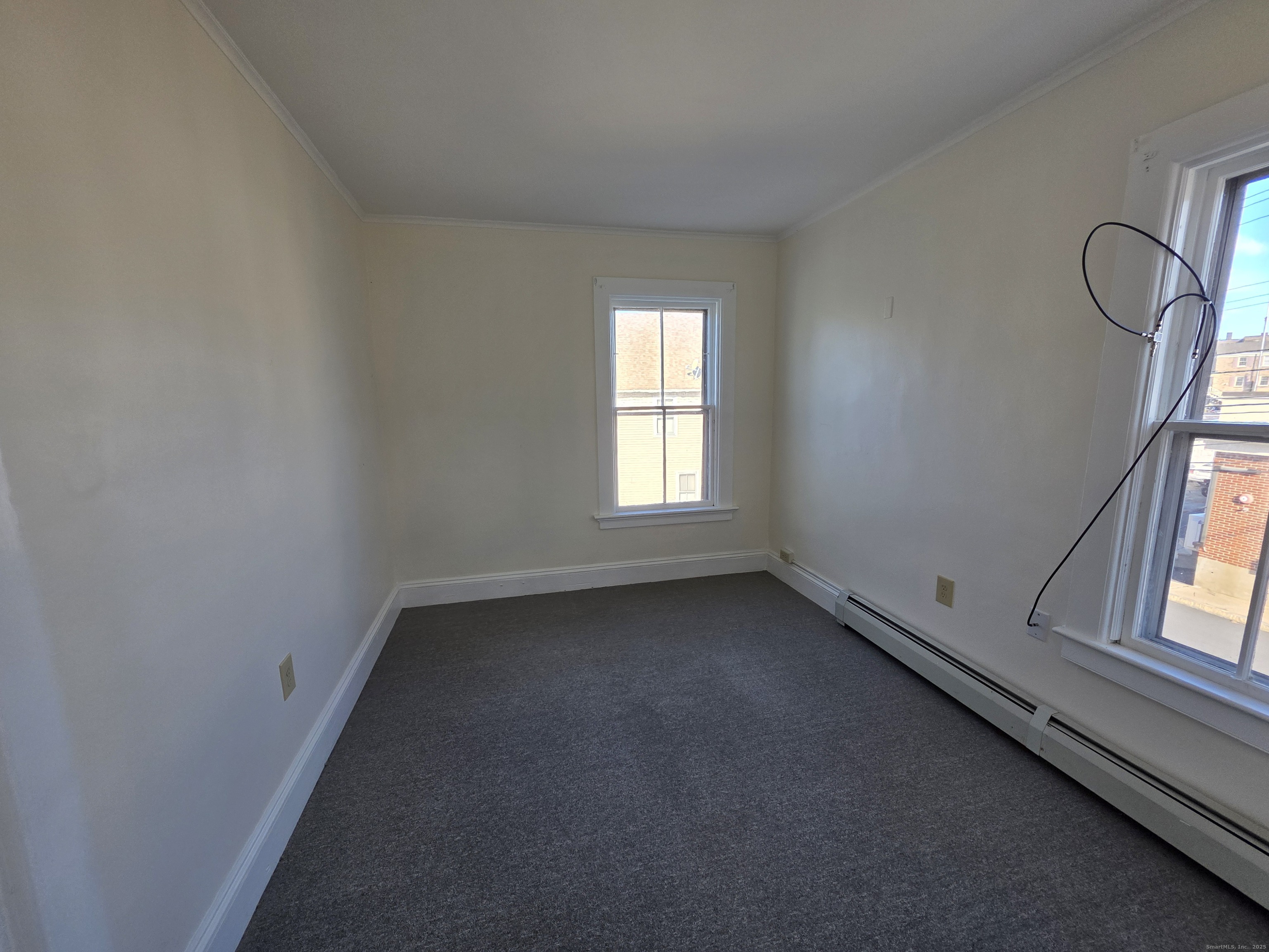 110 Main Street Griswold, CT 06351 - Photo 17 of 32 an empty room with windows