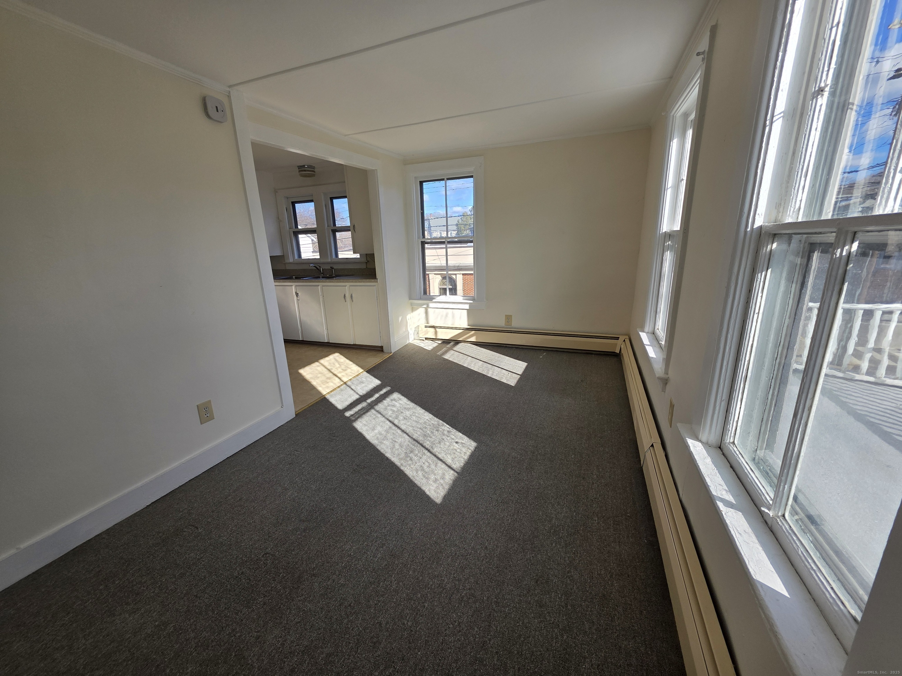 110 Main Street Griswold, CT 06351 - Photo 19 of 32 a view of empty room with windows
